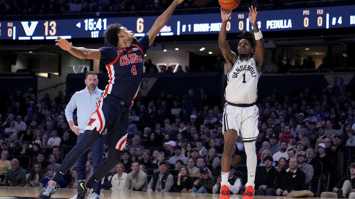 Vanderbilt guard Jason Edwards (1) shoots the ball past Mississippi forward Jaemyn Brakefield (4) during the first half of an NCAA college basketball game Saturday, Feb. 22, 2025, in Nashville, Tenn.