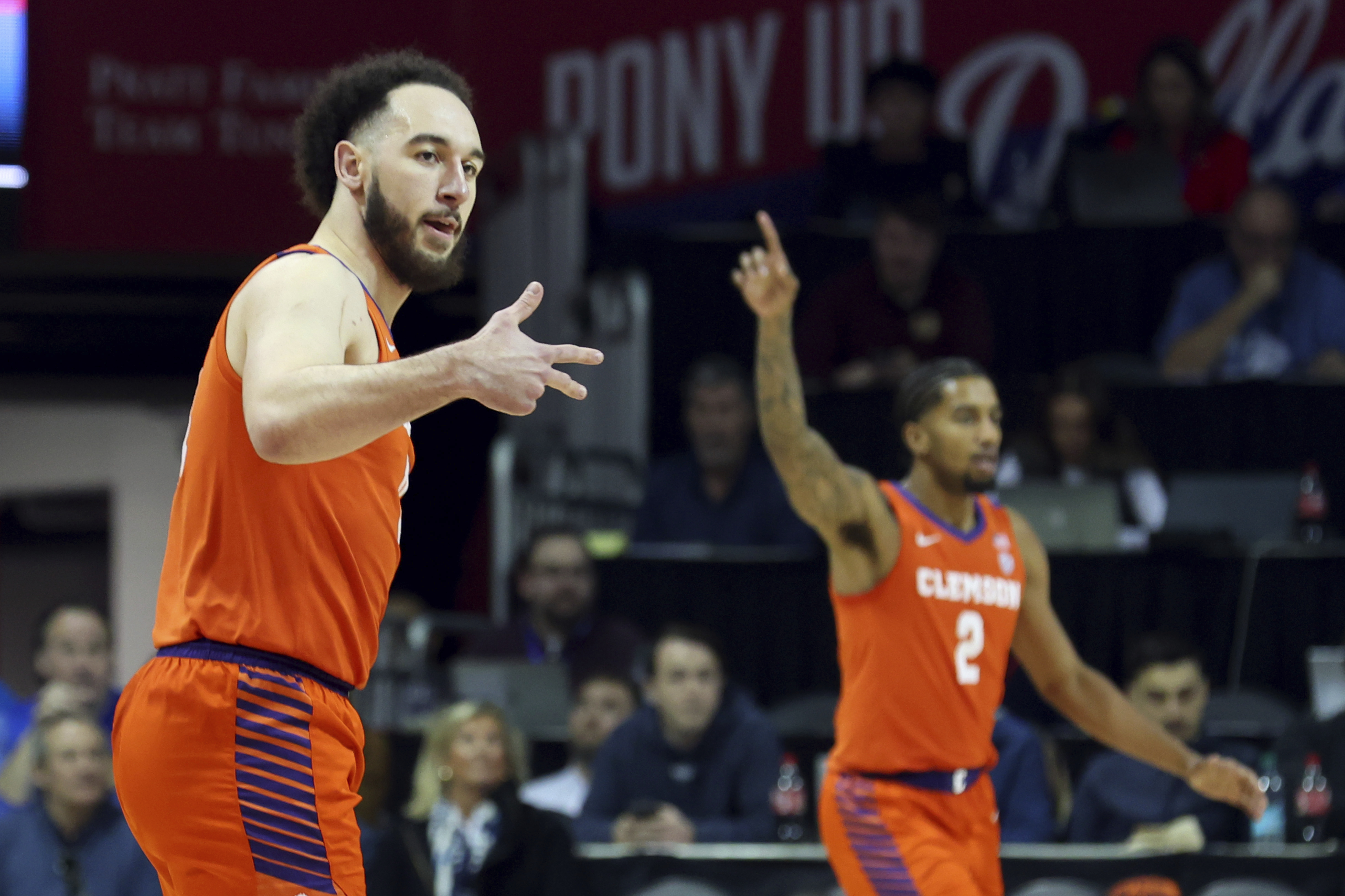 Clemson guard Jaeden Zackery (11) gestures after a three-pointer in the first half against Southern Methodist during an NCAA basketball game on Saturday, Feb. 22, 2025, in Dallas.