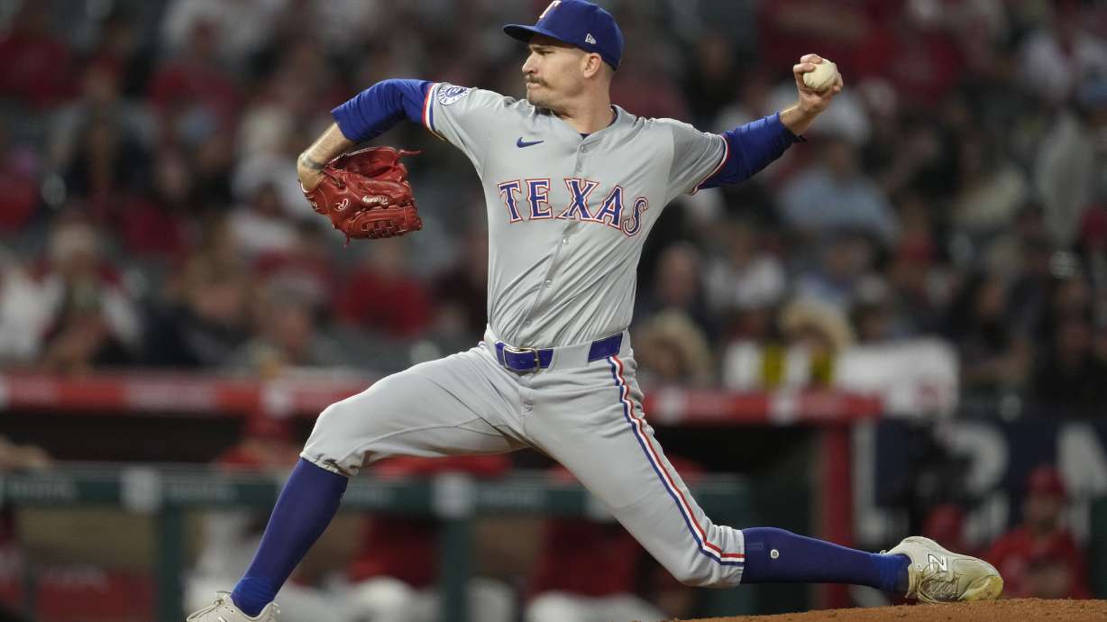 FILE - Texas Rangers starting pitcher Andrew Heaney throws during the first inning of a baseball game against the Los Angeles Angels in Anaheim, Calif., Sept. 28, 2024.