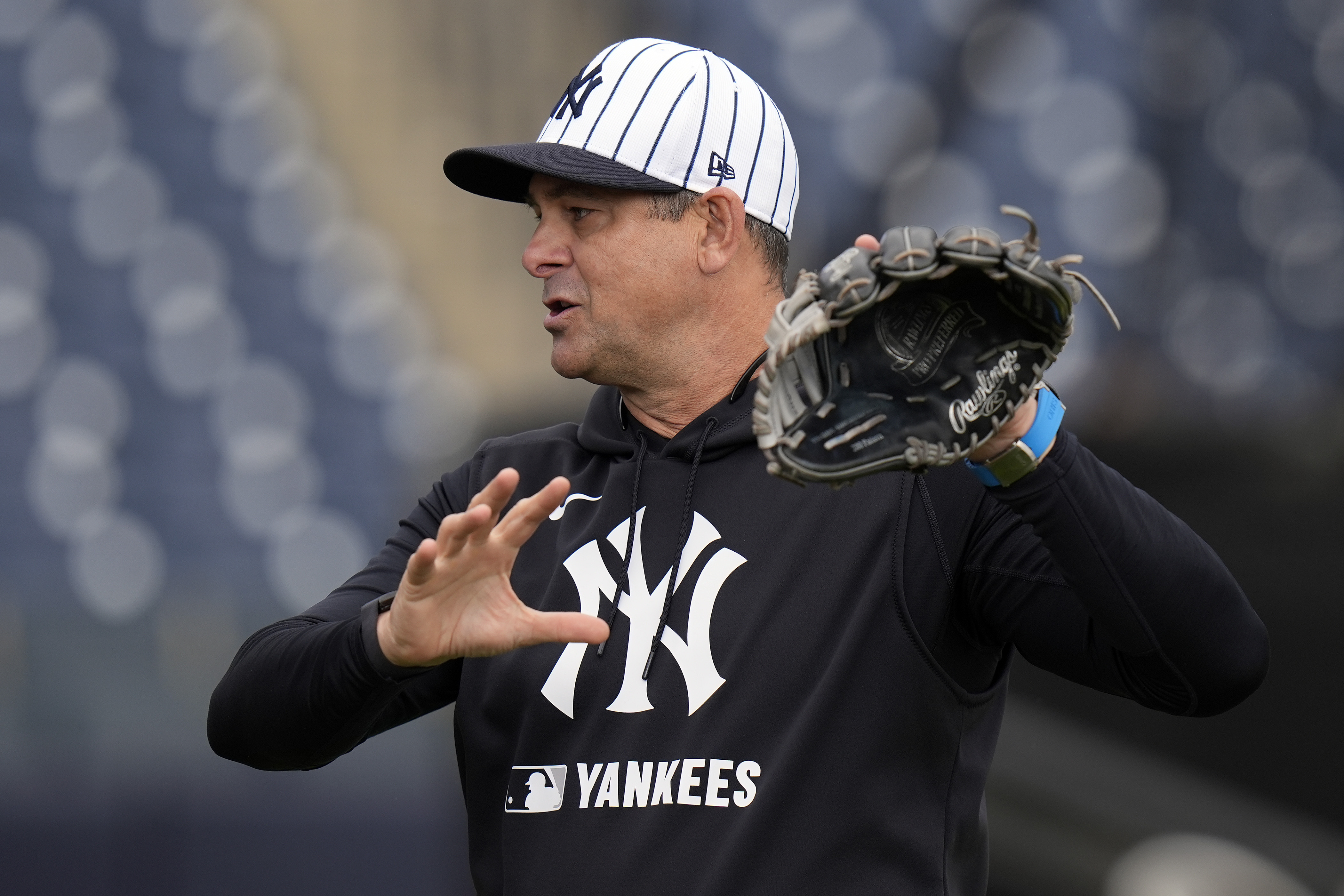 New York Yankees manager Aaron Boone demonstrates a play during a spring training baseball workout Thursday, Feb. 20, 2025, in Tampa, Fla. 