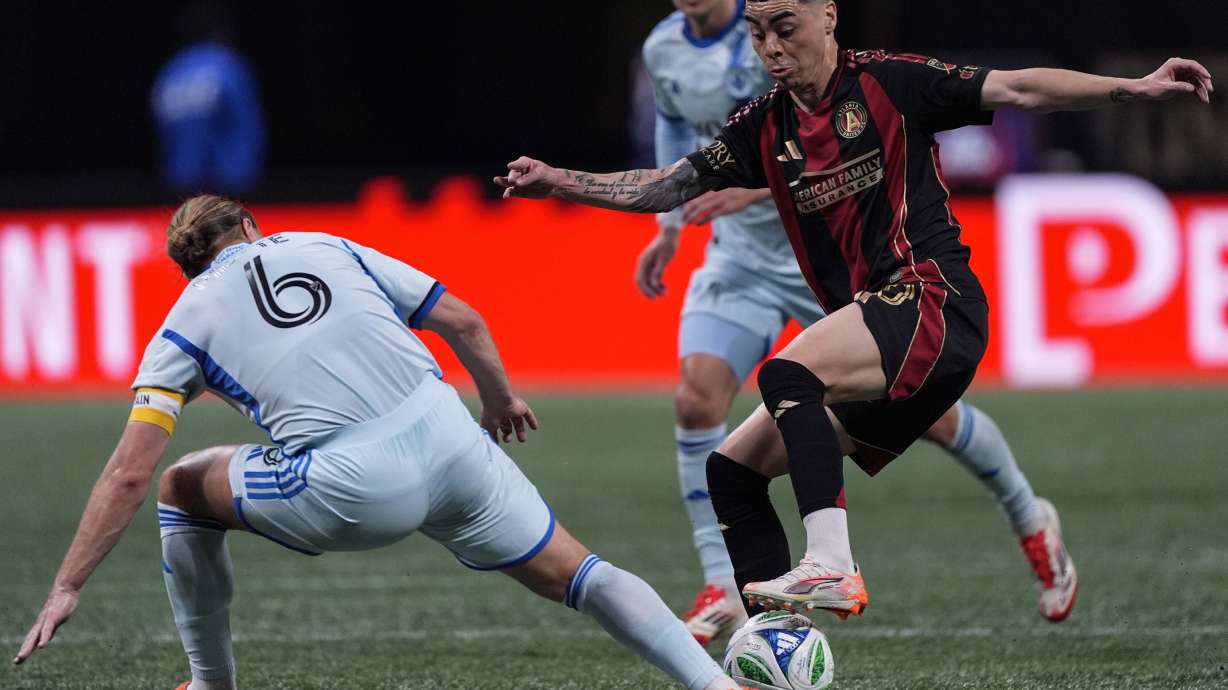 Atlanta United midfielder Miguel Almirón, front right, moves the ball against CF Montreal midfielder Samuel Piette (6) during the first half of an MLS soccer game, Saturday, Feb. 22, 2025, in Atlanta.