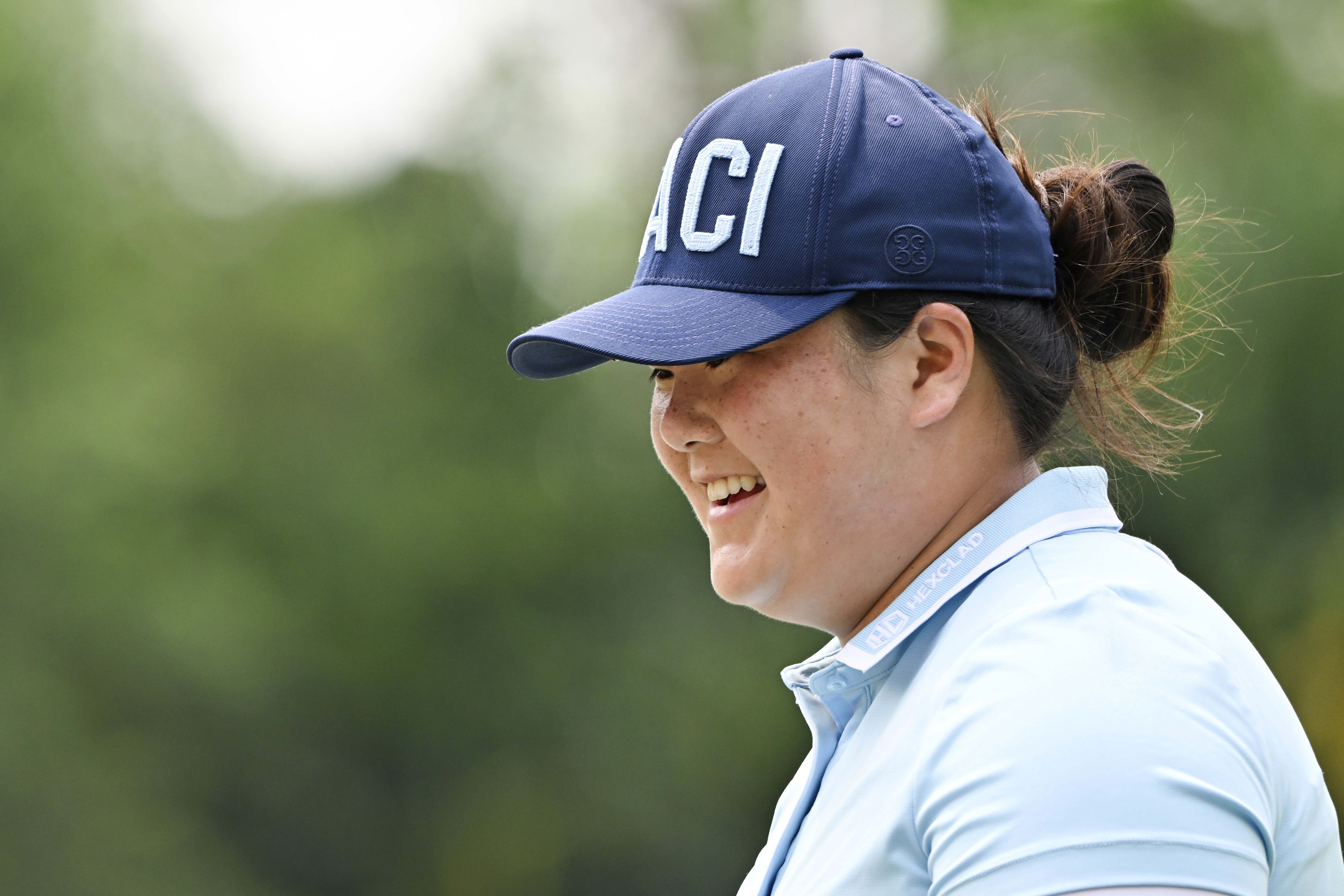 Angel Yin of the U.S. smile after her putt the eighth hole during final round of the LPGA Honda Thailand golf tournament in Pattaya, southern Thailand, Sunday, Feb. 23, 2025. 