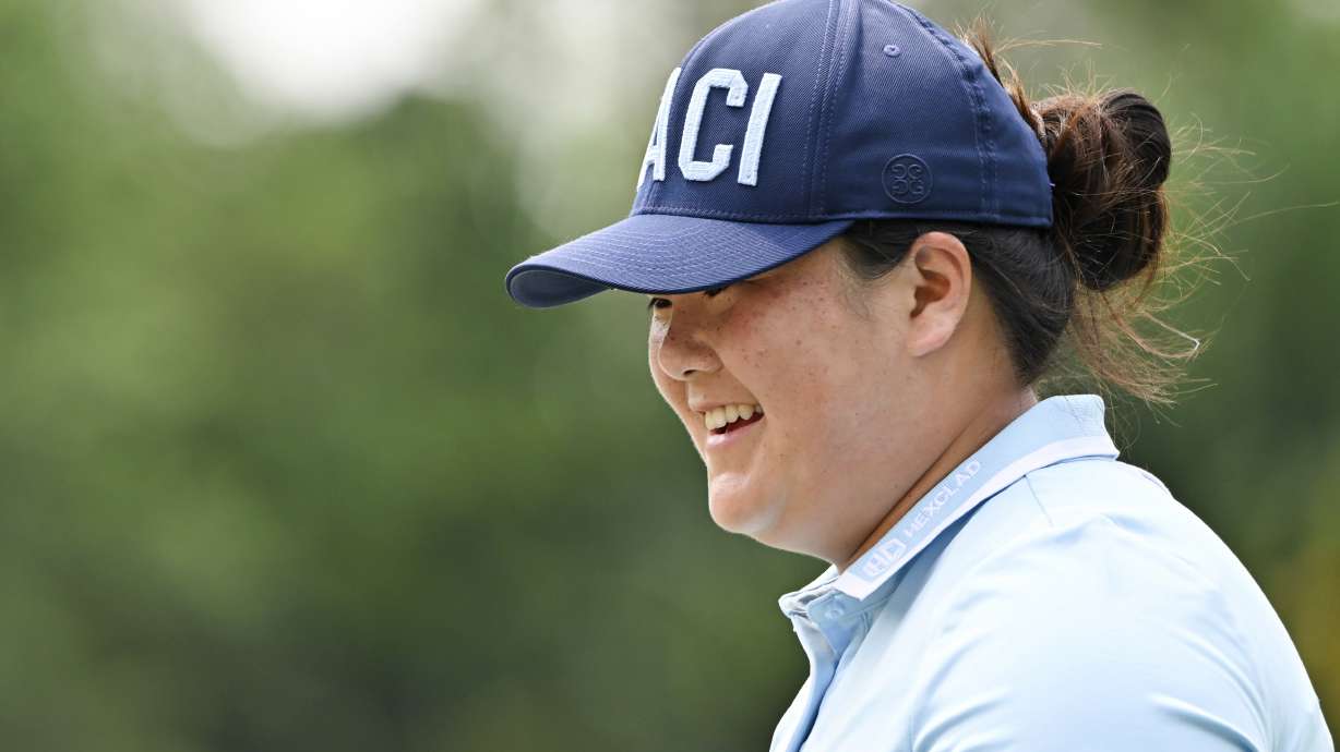 Angel Yin of the U.S. smile after her putt the eighth hole during final round of the LPGA Honda Thailand golf tournament in Pattaya, southern Thailand, Sunday, Feb. 23, 2025.