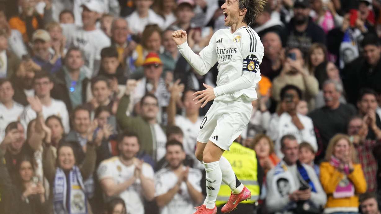 Real Madrid's Luka Modric celebrates after scoring the opening goal during the Spanish La Liga soccer match between Real Madrid and Girona at the Santiago Bernabeu stadium in Madrid, Spain, Sunday, Feb. 23, 2025.