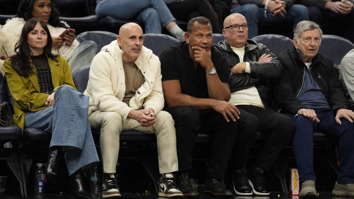 FILE - Minnesota Timberwolves minority owners Marc Lore, middle left, and Alex Rodriguez, middle right, watch during the second half of an NBA basketball game against the New York Knicks Dec. 19, 2024, in Minneapolis.