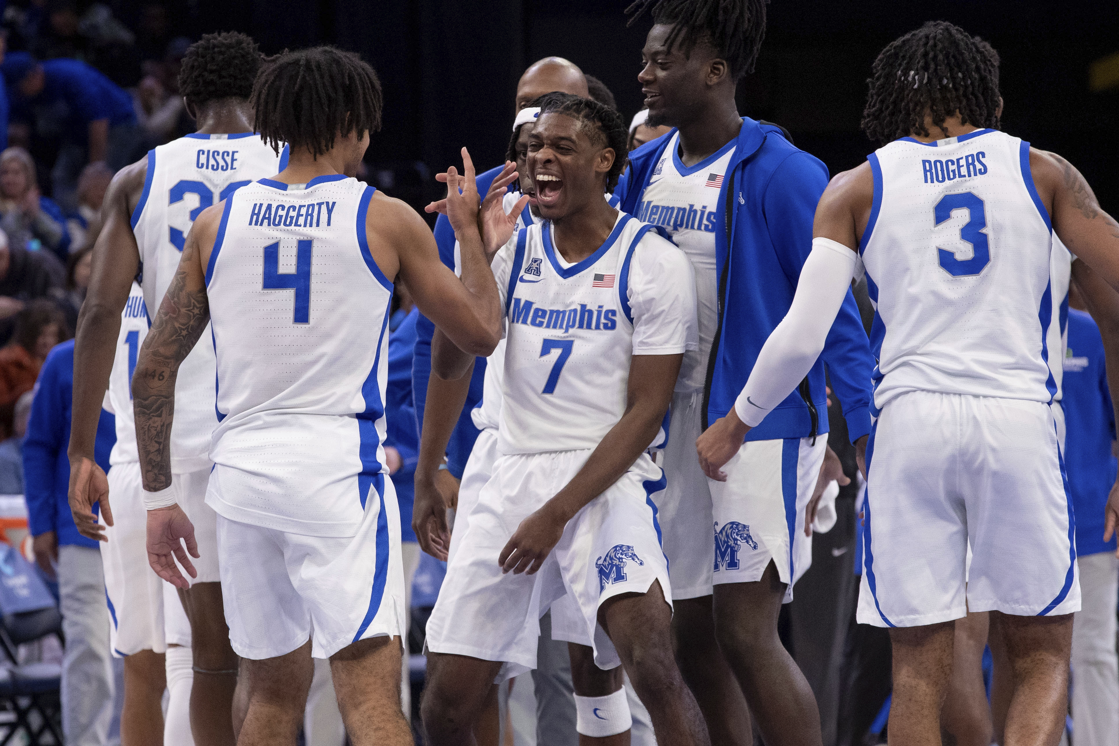 Memphis guard PJ Carter (7) celebrates with guard PJ Haggerty (4) during the second half of an NCAA college basketball game against Florida Atlantic, Sunday, Feb. 23, 2025, in Memphis, Tenn. 