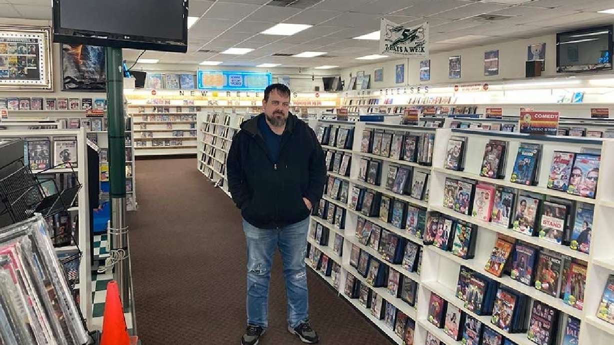 Owner David Kraning stands amongst what’s left of his inventory of his Pocatello, Idaho, video store in an undated photo.