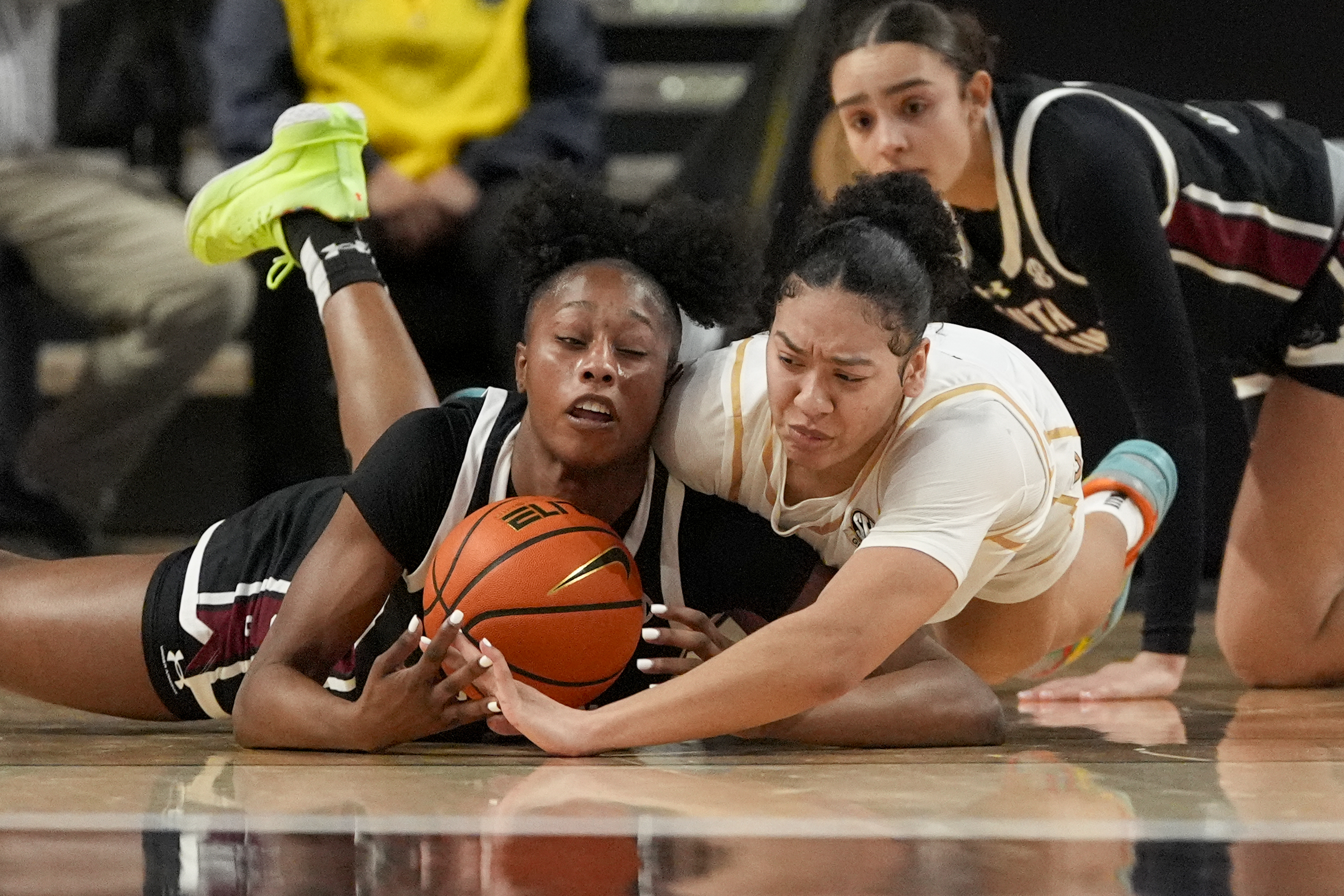 South Carolina forward Joyce Edwards, left, and Vanderbilt guard Leilani Kapinus, right, battle for the ball during the first half of an NCAA college basketball game Sunday, Feb. 23, 2025, in Nashville, Tenn. 
