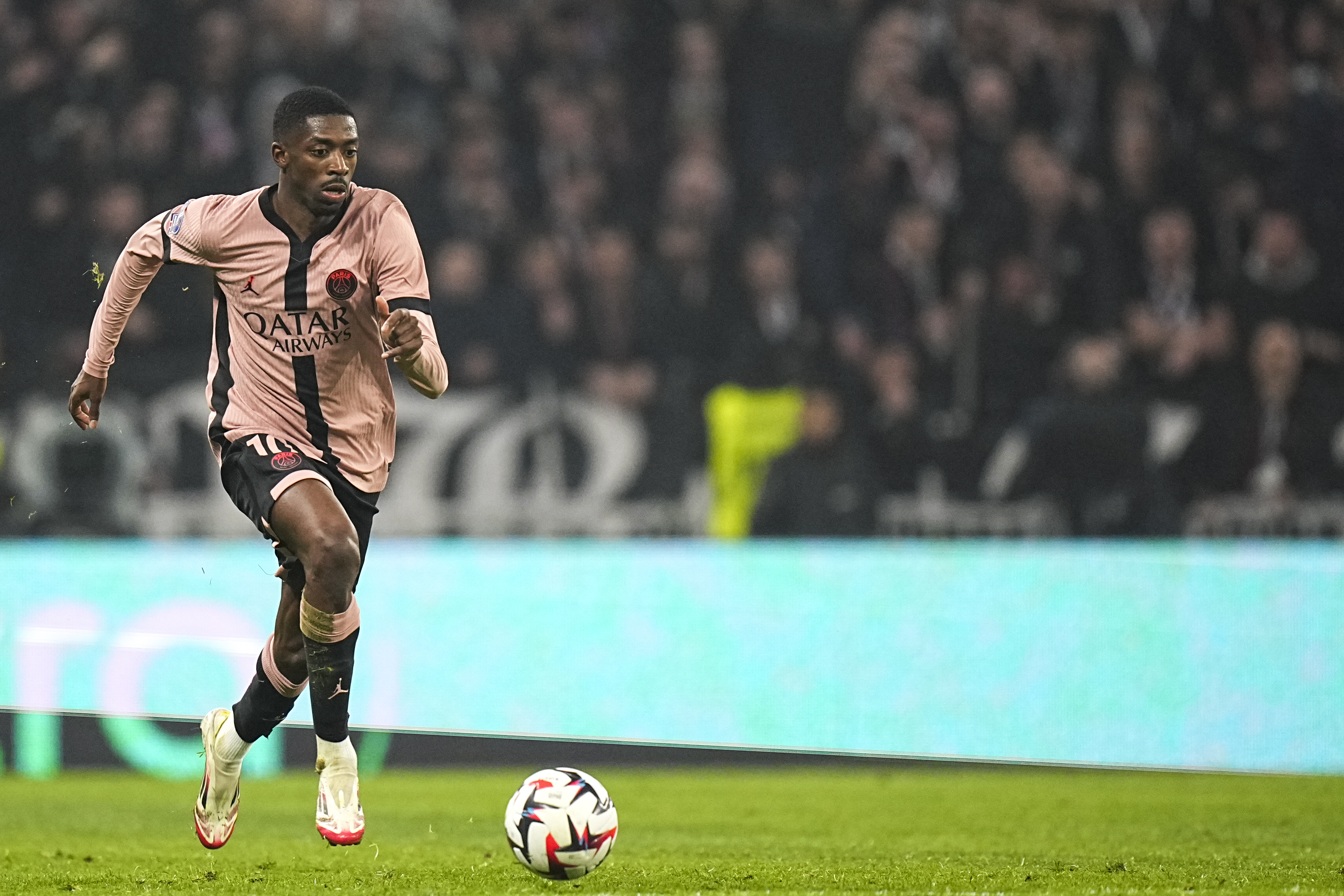 PSG's Ousmane Dembele controls the ball during the French League One soccer match between Lyon and Paris Saint-Germain at the Groupama stadium, outside Lyon, France, Sunday, Feb. 23, 2025.