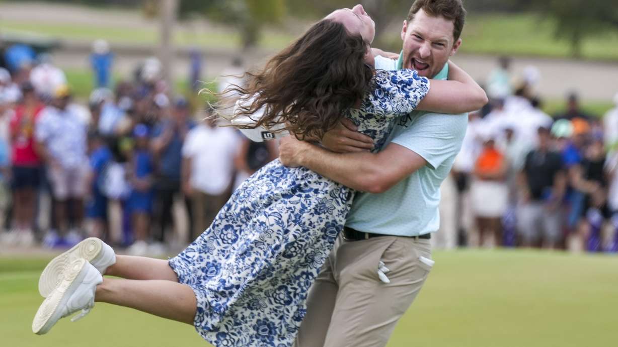Brian Campbell, of the United States, embraces his girlfriend Kelsi McKee after winning the Mexico Open golf tournament in Puerto Vallarta, Mexico, Sunday, Feb. 23, 2025.