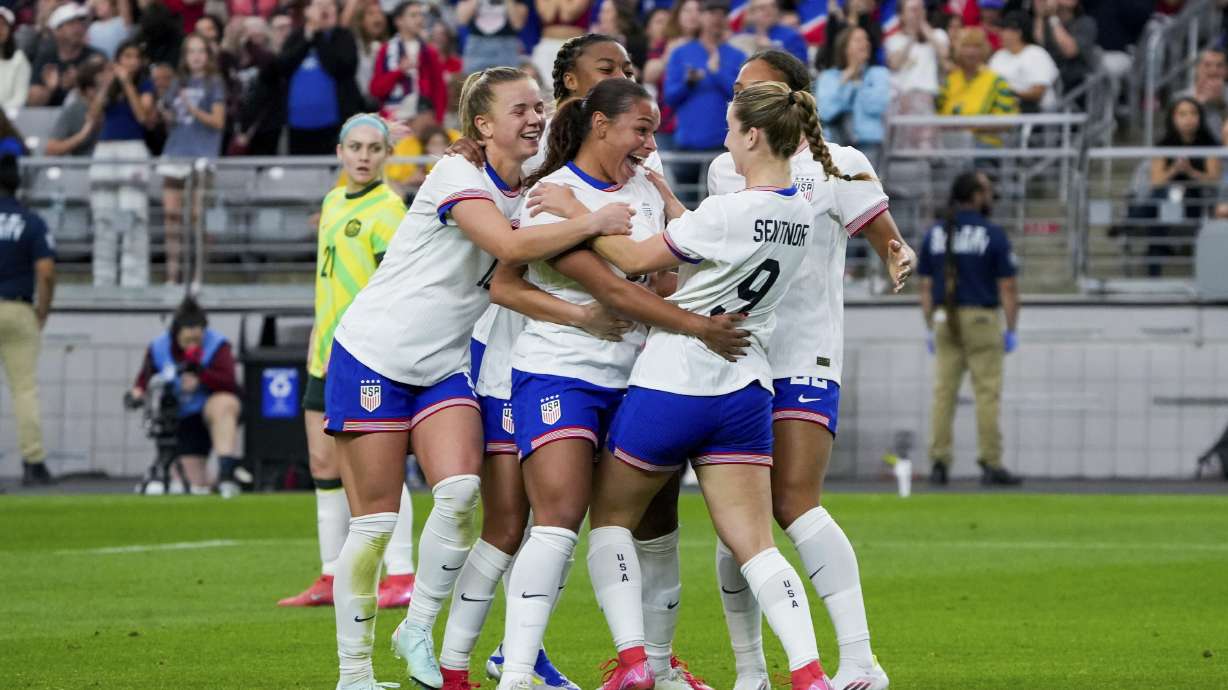 United States forward Michelle Cooper celebrates her first international goal with her teammates during the second half of a group stage match in the SheBelieves Cup women's soccer tournament against Australia, Sunday, Feb. 23, 2025, in Glendale, Ariz.