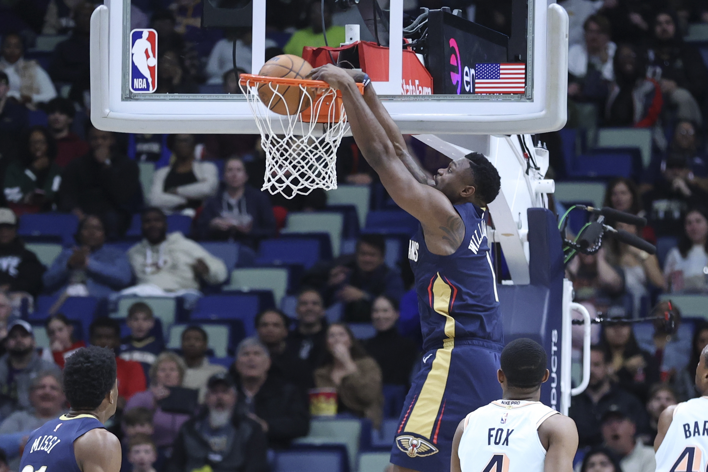 New Orleans Pelicans forward Zion Williamson (1) throws down a dunk in the first half of an NBA basketball game against the San Antonio Spurs in New Orleans, Sunday, Feb. 23, 2025. 