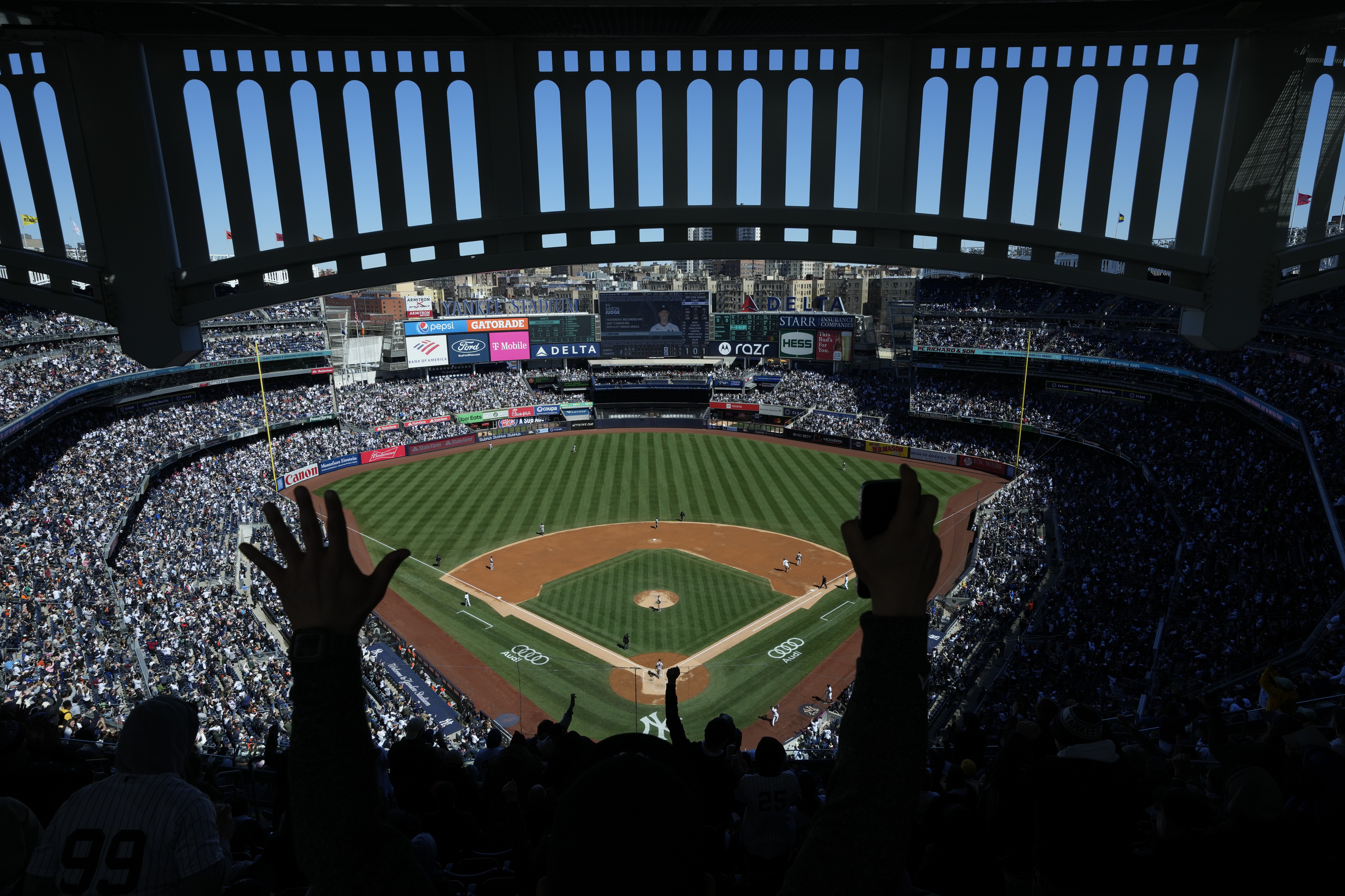FILE - Fans react after New York Yankees' Aaron Judge hits a home run during the third inning of a baseball game against the San Francisco Giants at Yankee Stadium, April 2, 2023, in New York.