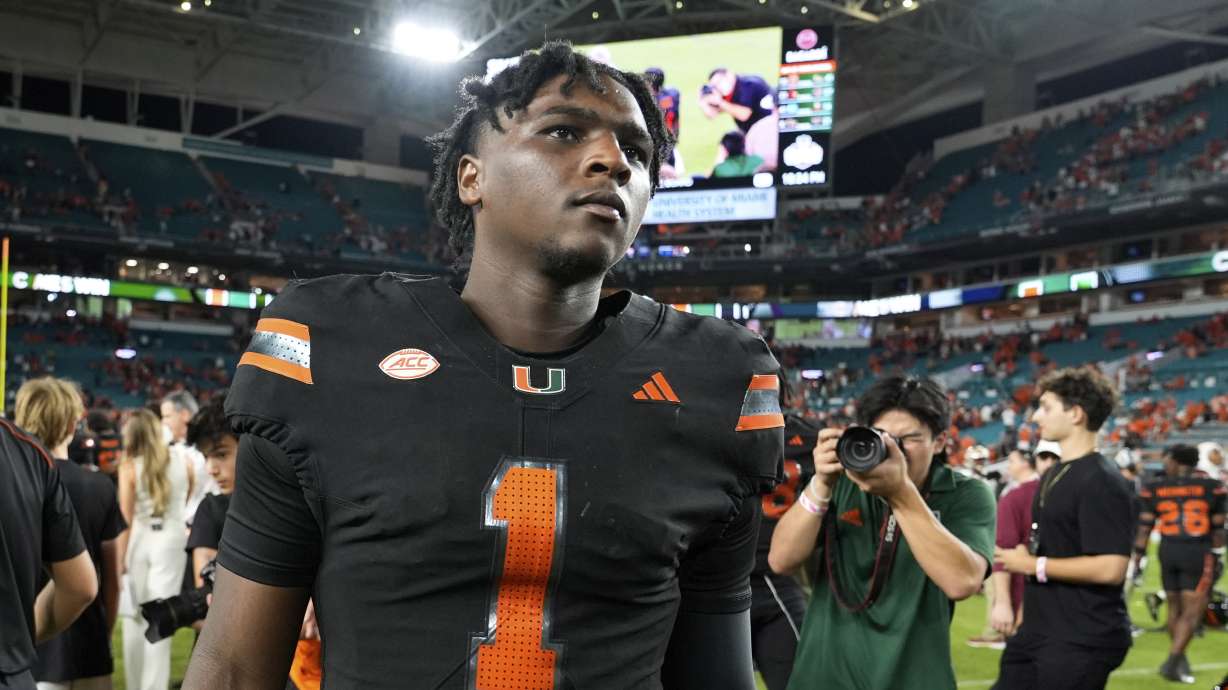 FILE - Miami quarterback Cam Ward (1) walks off the field after an NCAA college football game against Florida State, Oct. 26, 2024, in Miami Gardens, Fla.