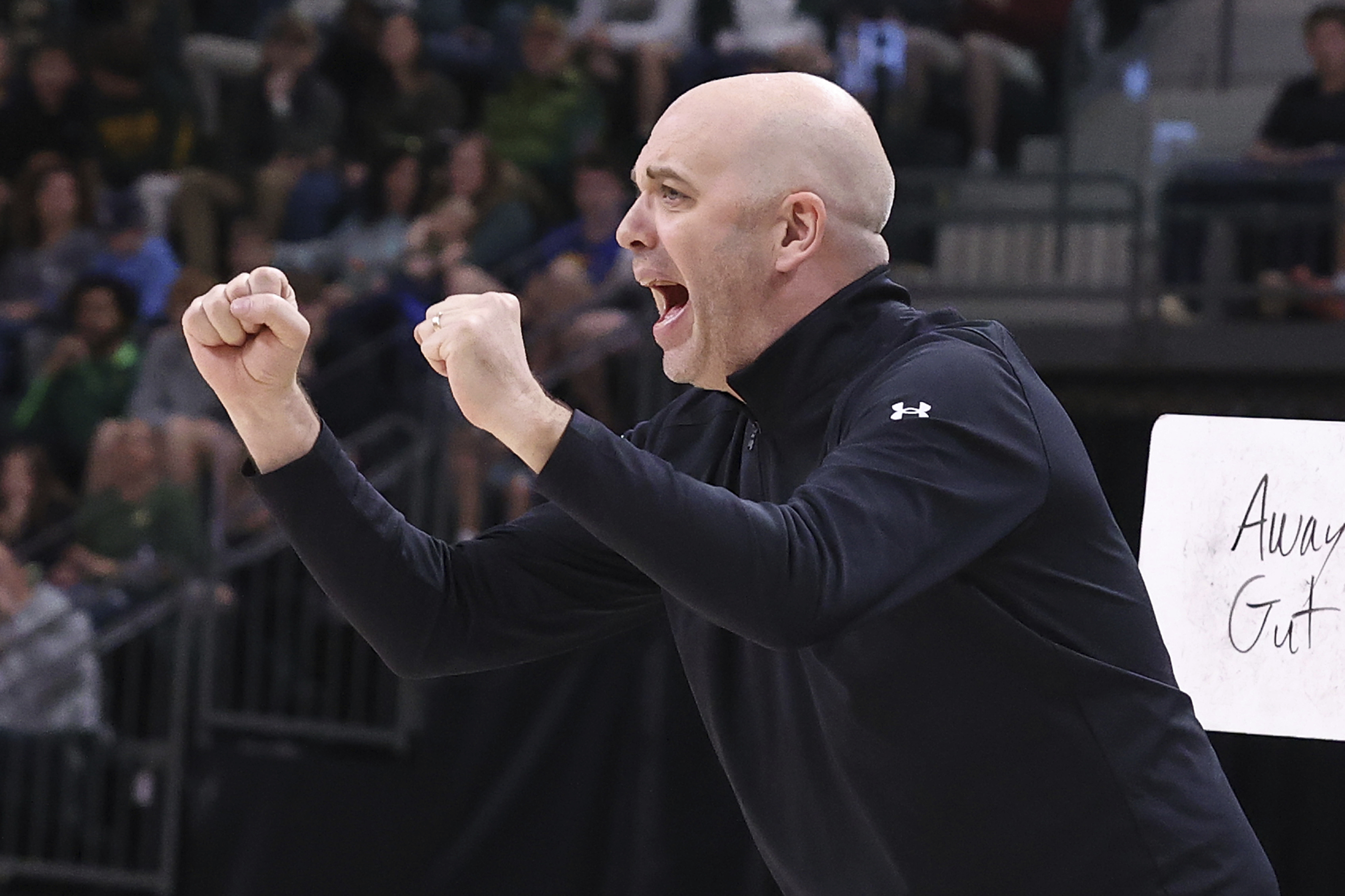 FILE - Utah head coach Craig Smith calls a play to his team during the first half of an NCAA college basketball game against Baylor, Dec. 31, 2024, in Waco, Texas. 