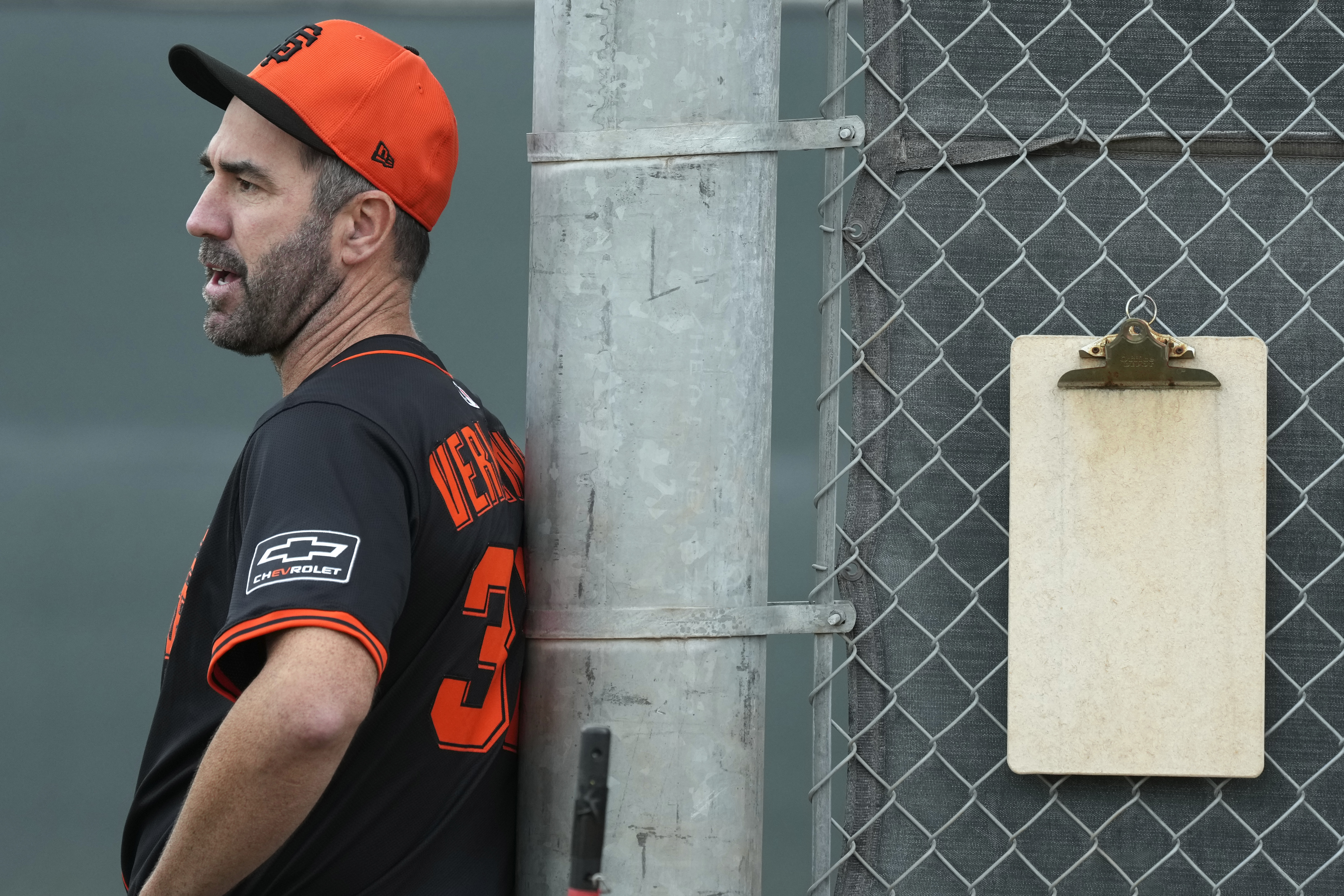 San Francisco Giants pitcher Justin Verlander watches other pitchers throw at the team's spring training baseball facility Thursday, Feb. 13, 2025, in Scottsdale, Ariz. 