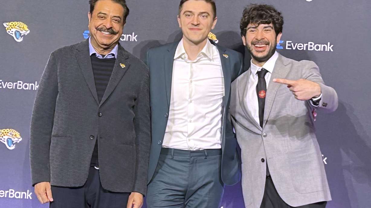 New Jacksonville Jaguars general manager James Gladstone, center, at his introductory news conference alongside Jaguars owners Shad Khan, left, and Tony Khan, right, in Jacksonville, Fla., Monday, Feb. 24, 2025.