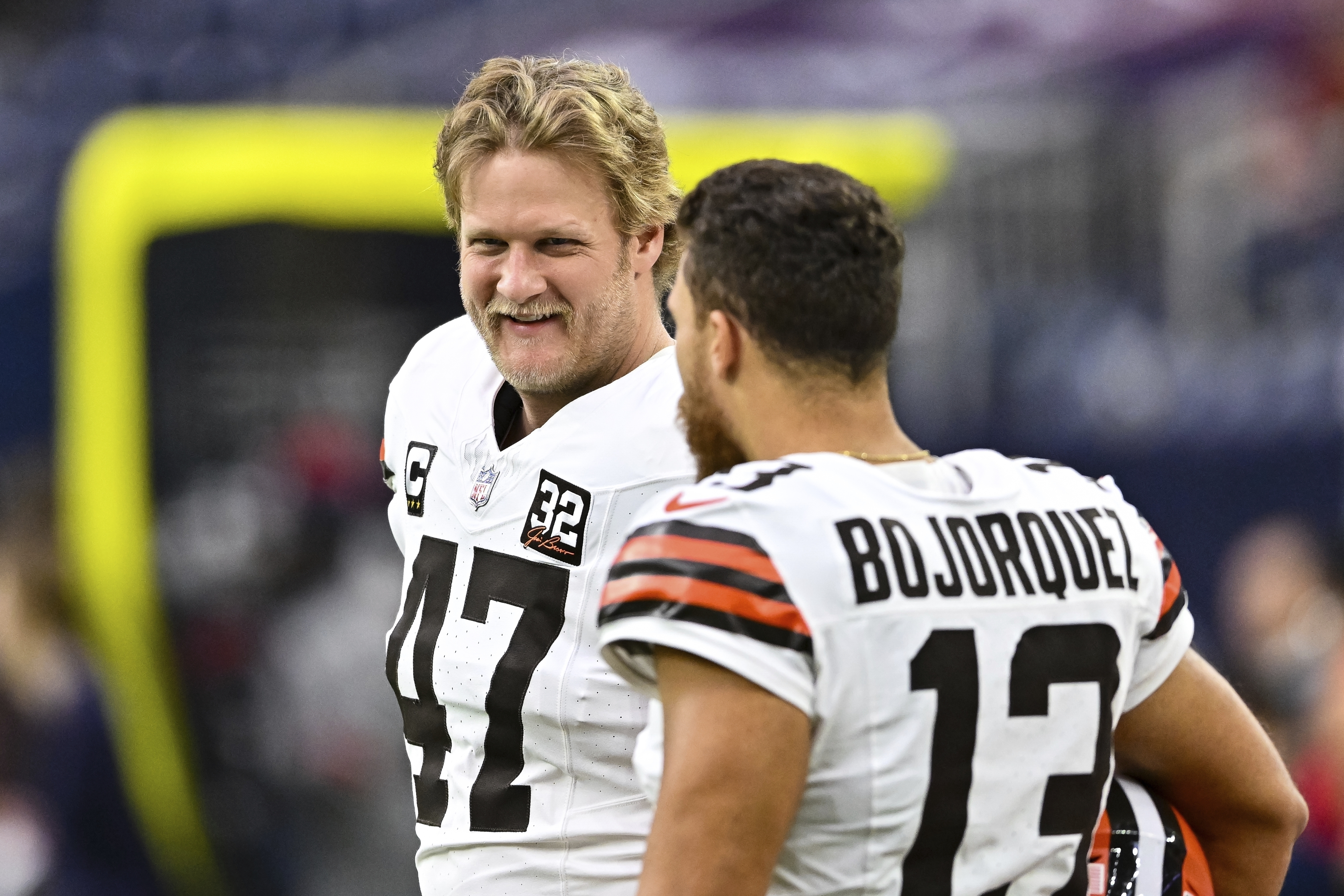 FILE - Cleveland Browns long snapper Charley Hughlett (47) and punter Corey Bojorquez (13) stand on the sideline prior to an NFL football game, Dec 24, 2023, in Houston.