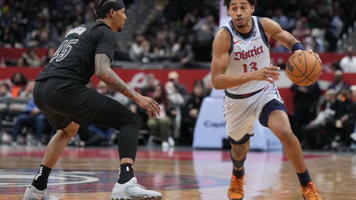 Washington Wizards guard Jordan Poole (13) dribbles downcourt as Brooklyn Nets guard Keon Johnson (45) defends during the first half of an NBA basketball game Monday, Feb. 24, 2025, in Washington.