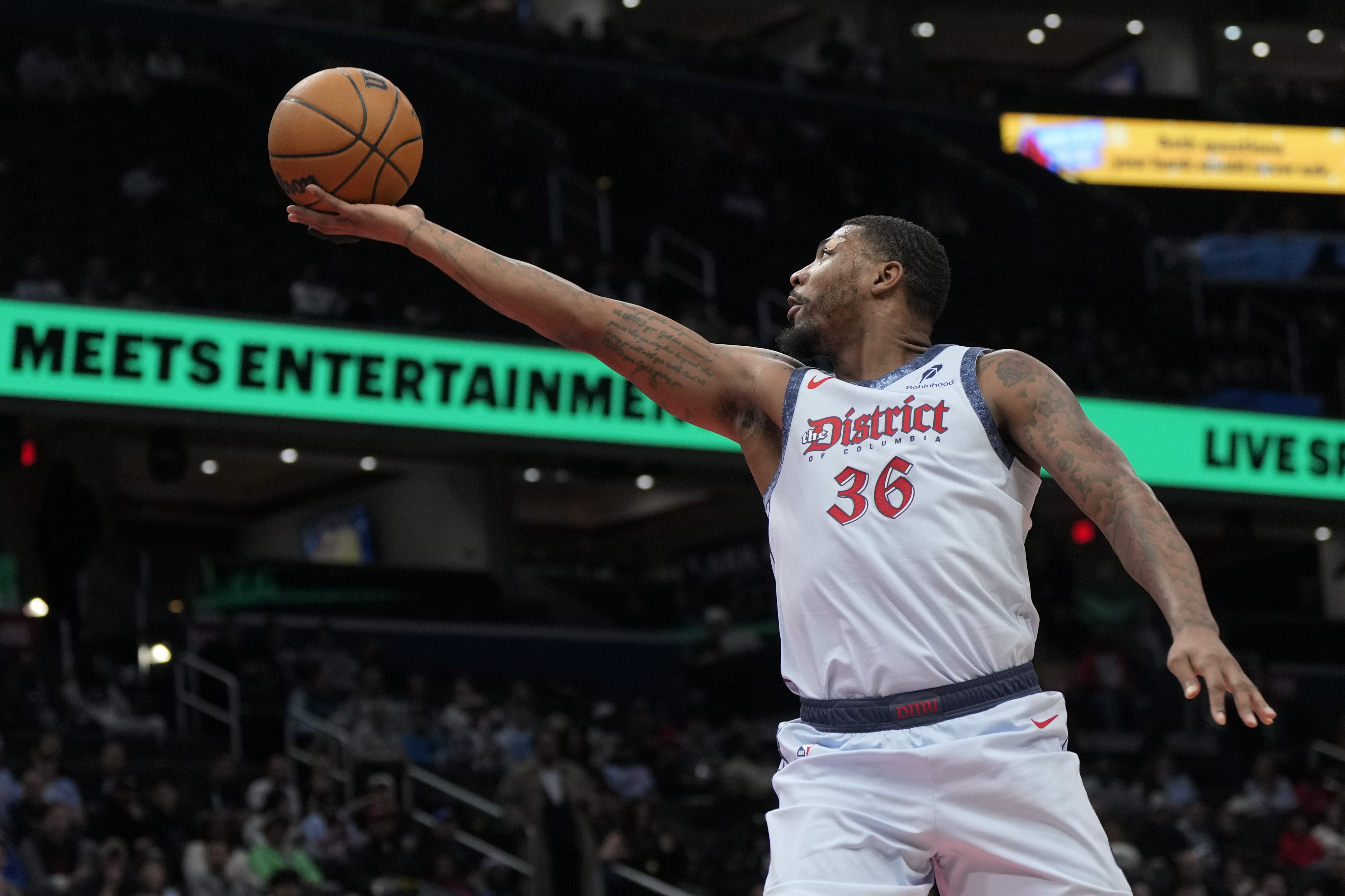 Washington Wizards guard Marcus Smart goes up to shoot against the Brooklyn Nets during the first half of an NBA basketball game Monday, Feb. 24, 2025, in Washington. 
