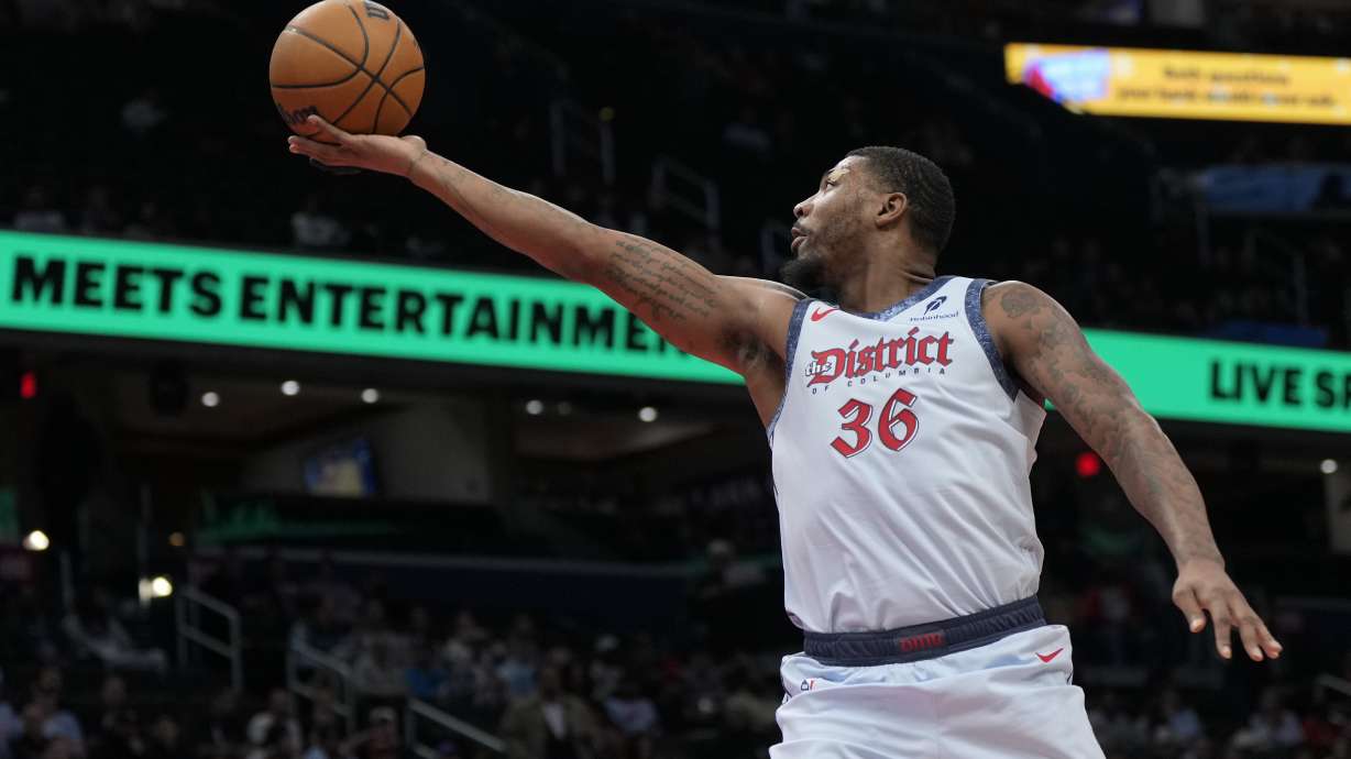 Washington Wizards guard Marcus Smart goes up to shoot against the Brooklyn Nets during the first half of an NBA basketball game Monday, Feb. 24, 2025, in Washington.