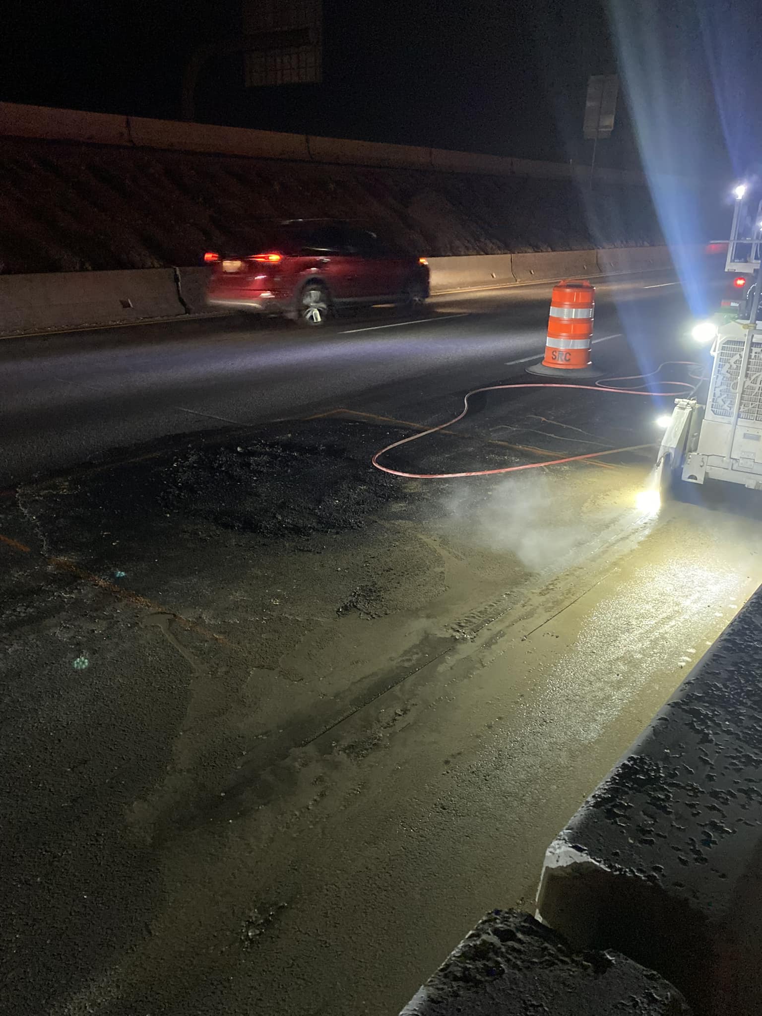 Crews work on damaged pavement on I-15 in Roy on Monday night.