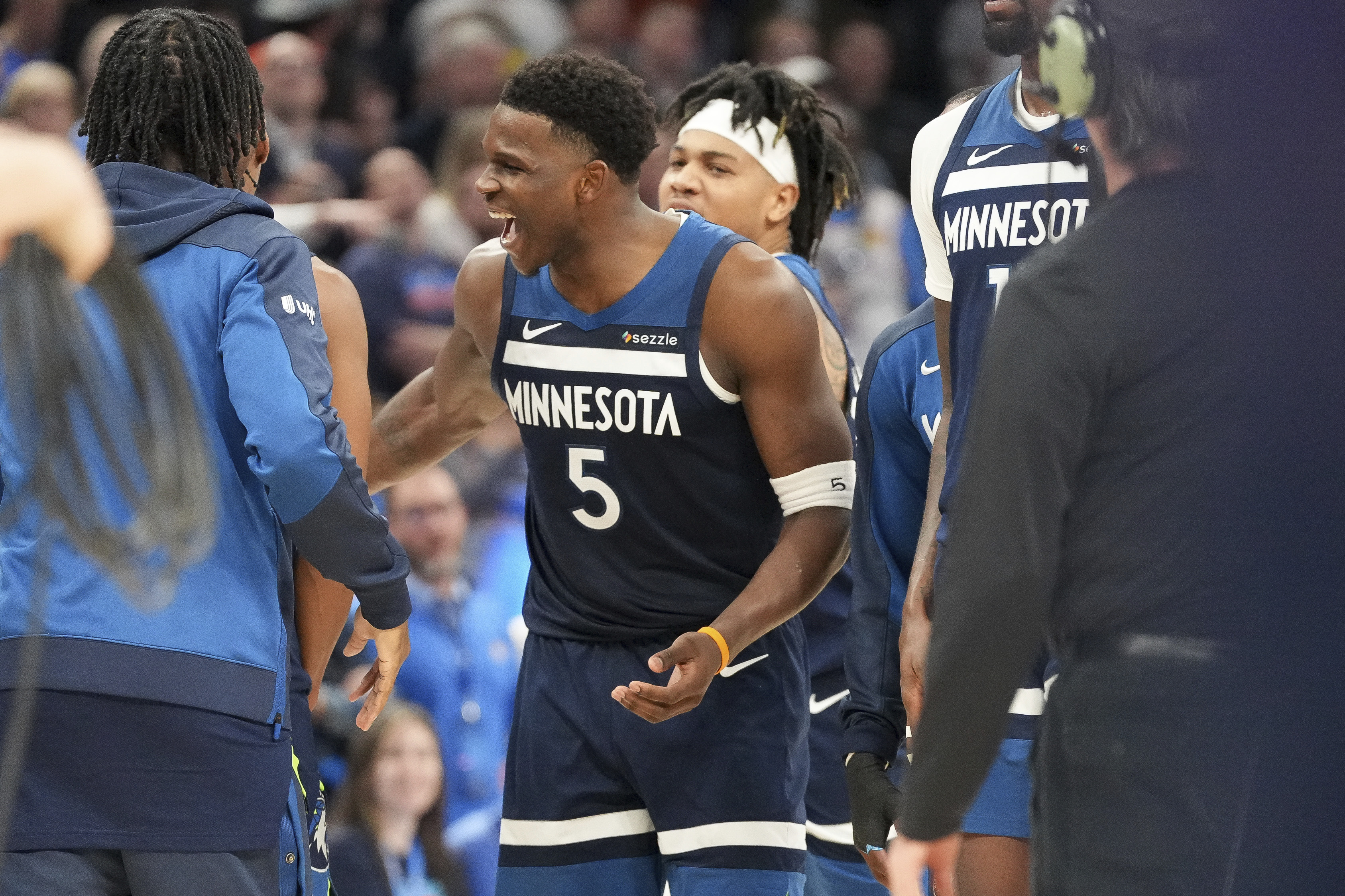 Minnesota Timberwolves guard Anthony Edwards (5) celebrates during a timeout during overtime of an NBA basketball game against the Oklahoma City Thunder, Monday, Feb. 24, 2025, in Oklahoma City.