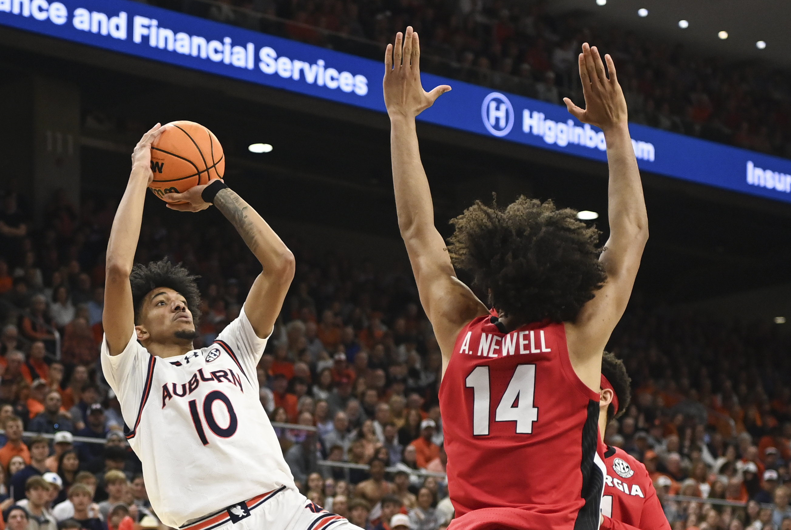 Auburn forward/guard Chad Baker-Mazara (10) shoots over Georgia forward Asa Newell (14) during the second half an NCAA college basketball game Saturday, Feb. 22, 2025, in Auburn, Ala. 