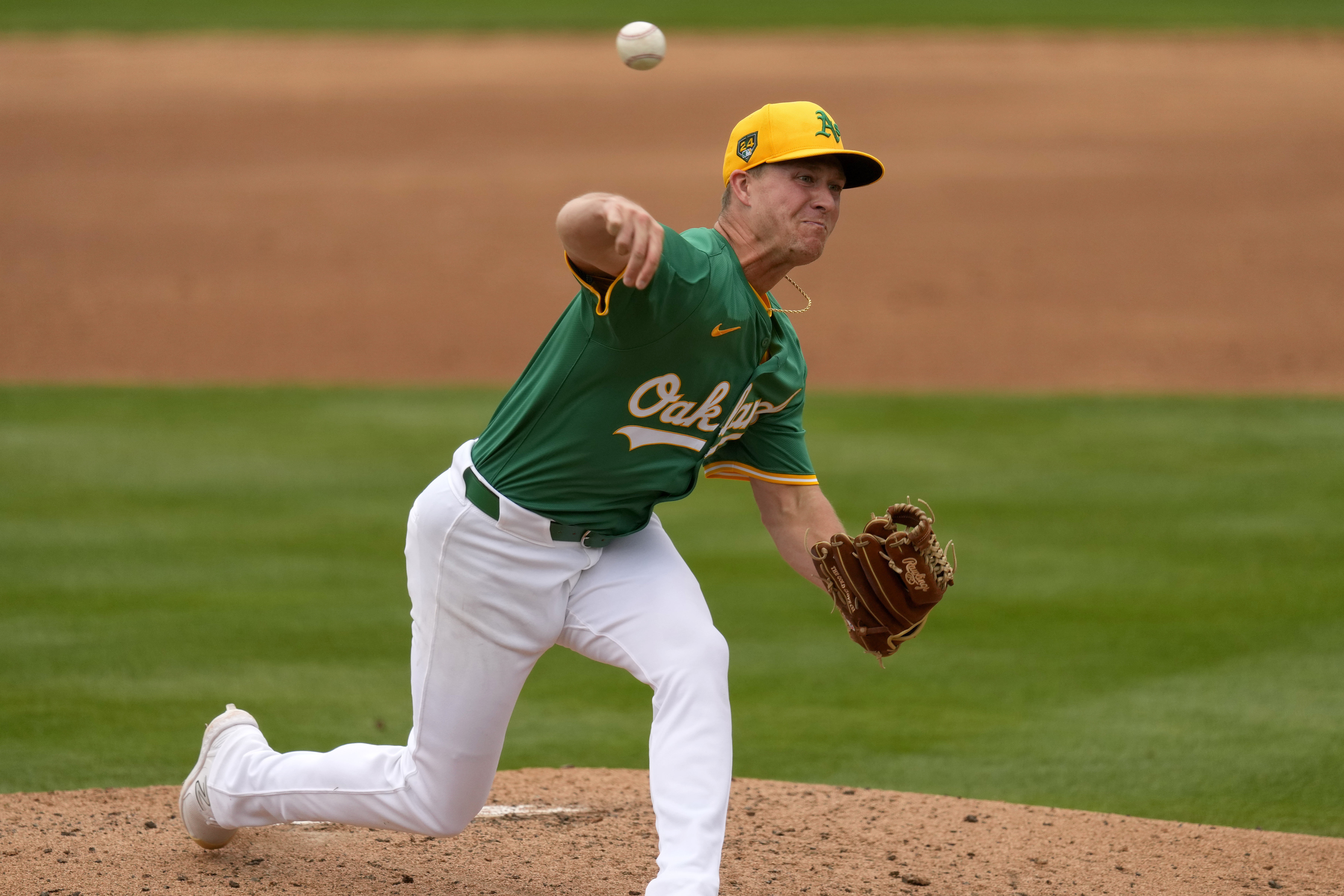 FILE - Oakland Athletics pitcher Trevor Gott throws against the Arizona Diamondbacks during the third inning of a spring training baseball game, Feb. 26, 2024, in Mesa, Ariz. 
