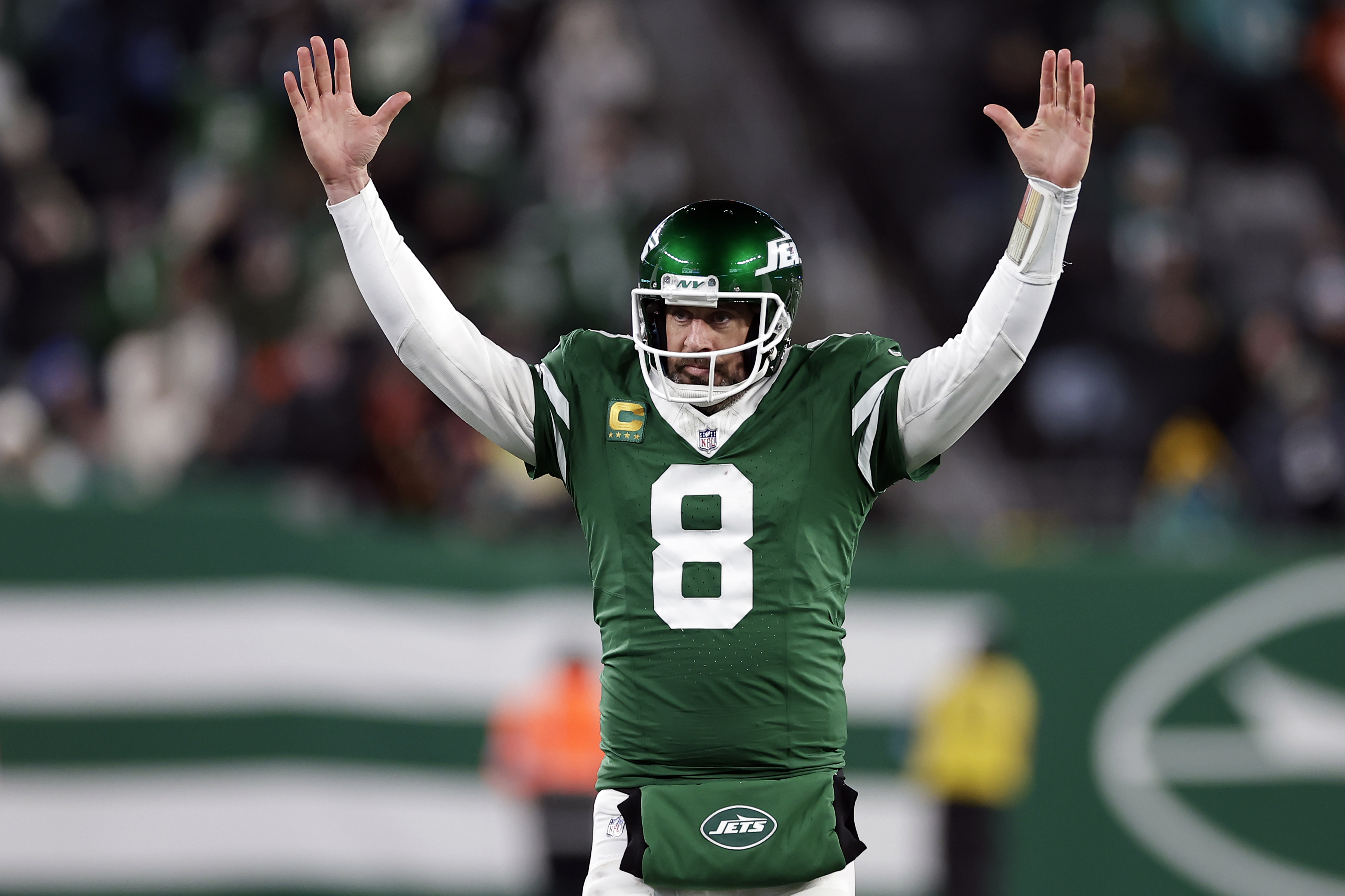 FILE - New York Jets quarterback Aaron Rodgers (8) reacts after a touchdown pass during an NFL football game against the Miami Dolphins Sunday, Jan. 5, 2025, in East Rutherford, N.J. 