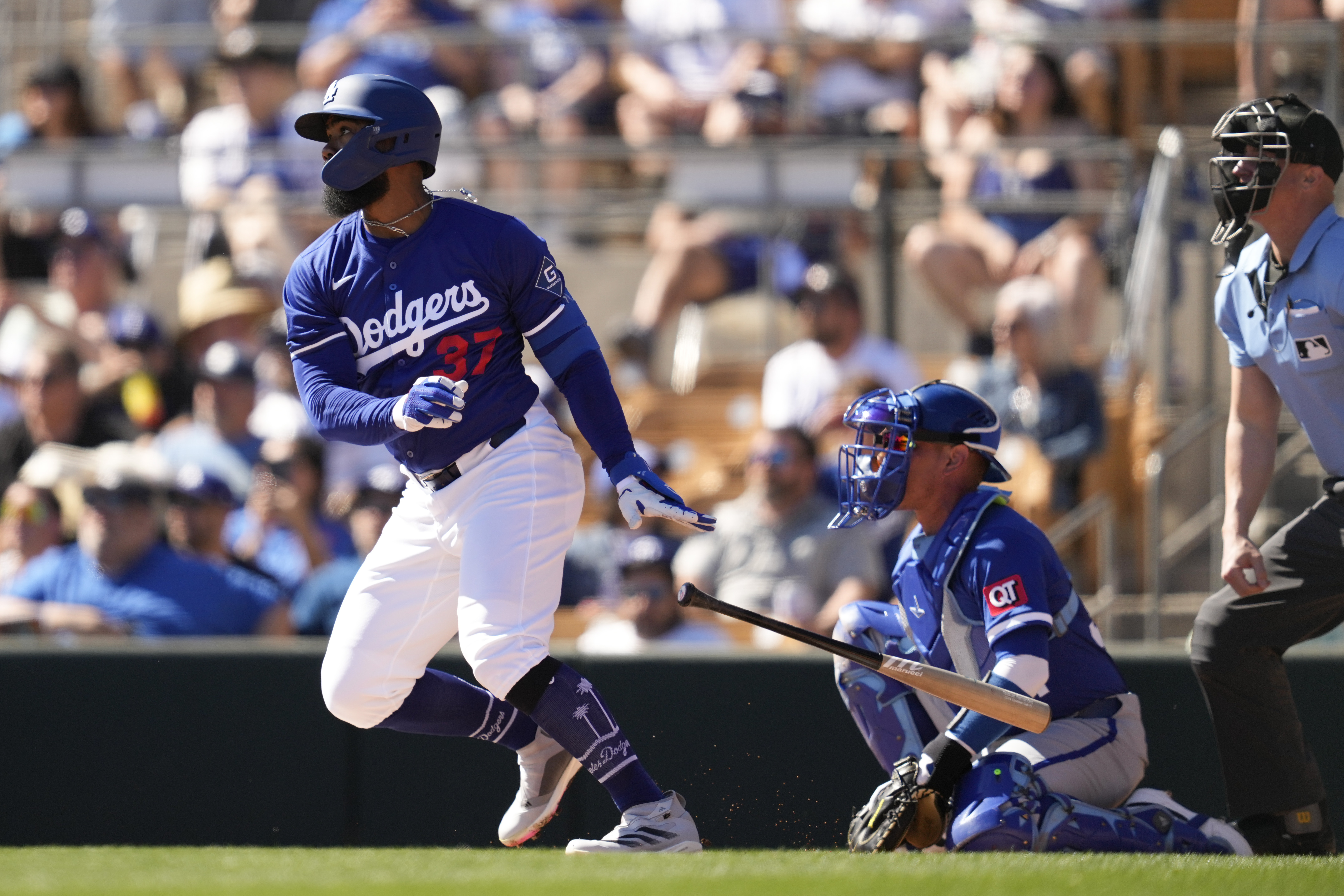 Los Angeles Dodgers' Teoscar Hernández (37) doubles during the first inning of a spring training baseball game against the Kansas City Royals, Saturday, Feb. 22, 2025, in Phoenix. 