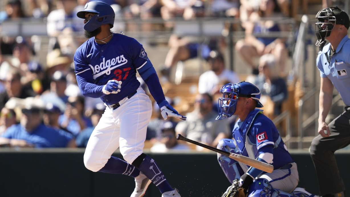 Los Angeles Dodgers' Teoscar Hernández (37) doubles during the first inning of a spring training baseball game against the Kansas City Royals, Saturday, Feb. 22, 2025, in Phoenix.
