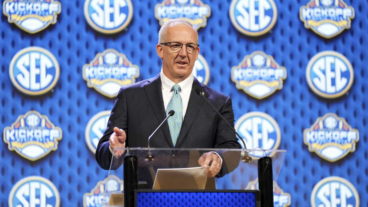 FILE - Southeastern Conference commissioner Greg Sankey speaks during SEC NCAA college football media days, July 15, 2024, in Dallas.