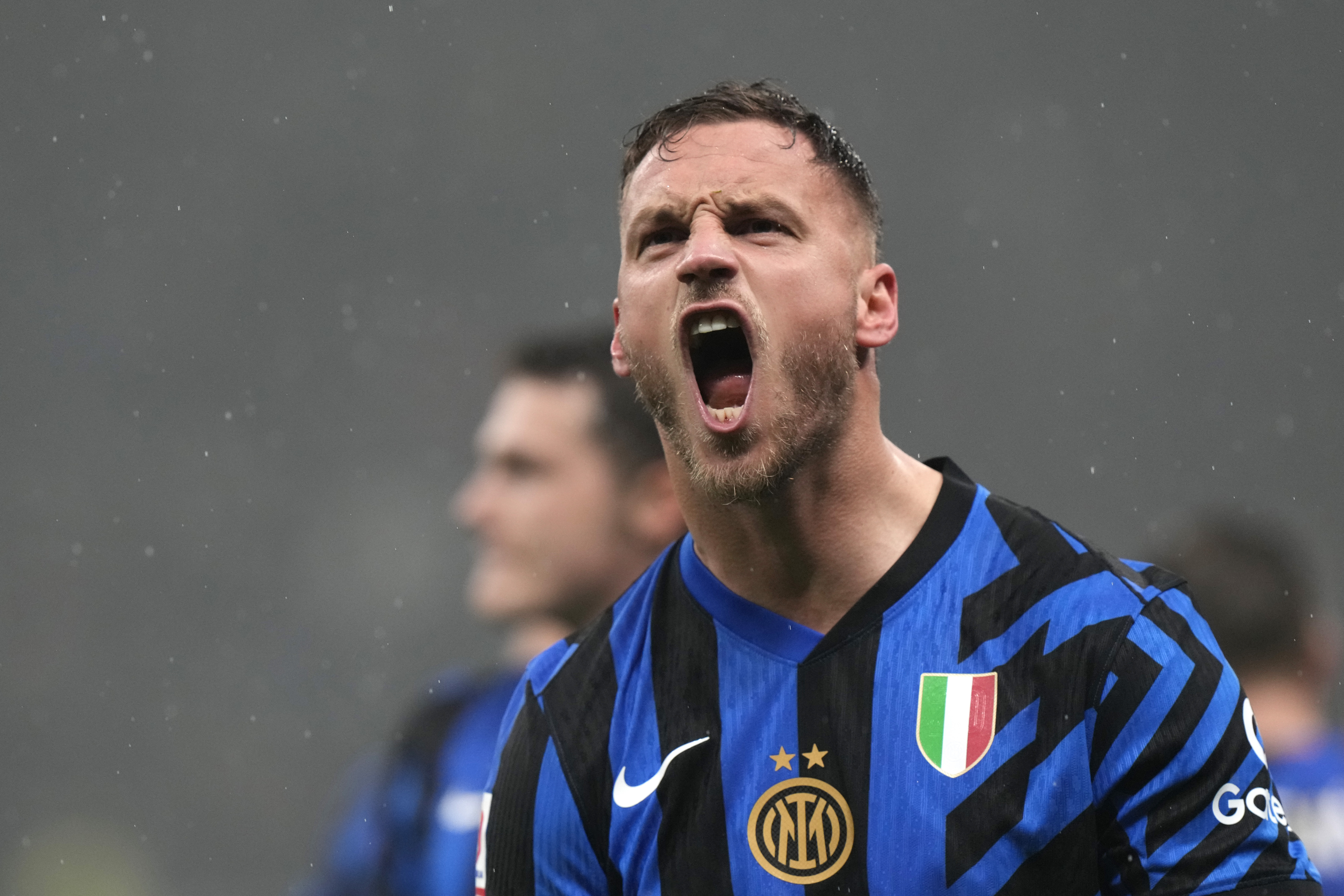 Inter Milan's Marko Arnautovic celebrates after scoring his side's opening goal during an Italian Cup quarter final soccer match between Inter Milan and Lazio, at the San Siro stadium in Milan, Italy, Tuesday, Feb. 25, 2025. 