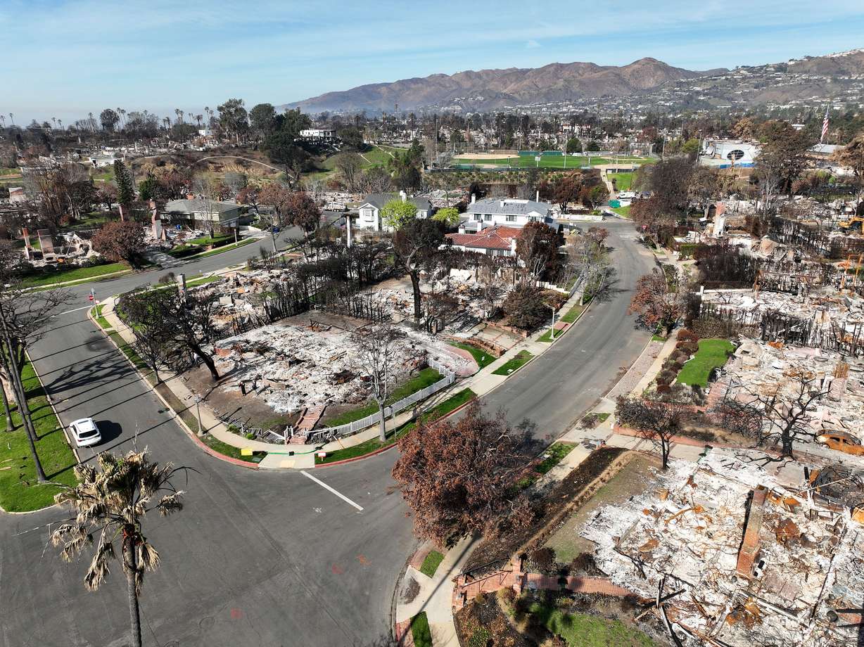 The Garff family home is pictured amid the ruins of other homes in Pacific Palisades, Calif., on Feb. 22. It was one of many destroyed by the recent wildfires that swept through Southern California. The family is planning on rebuilding their home.