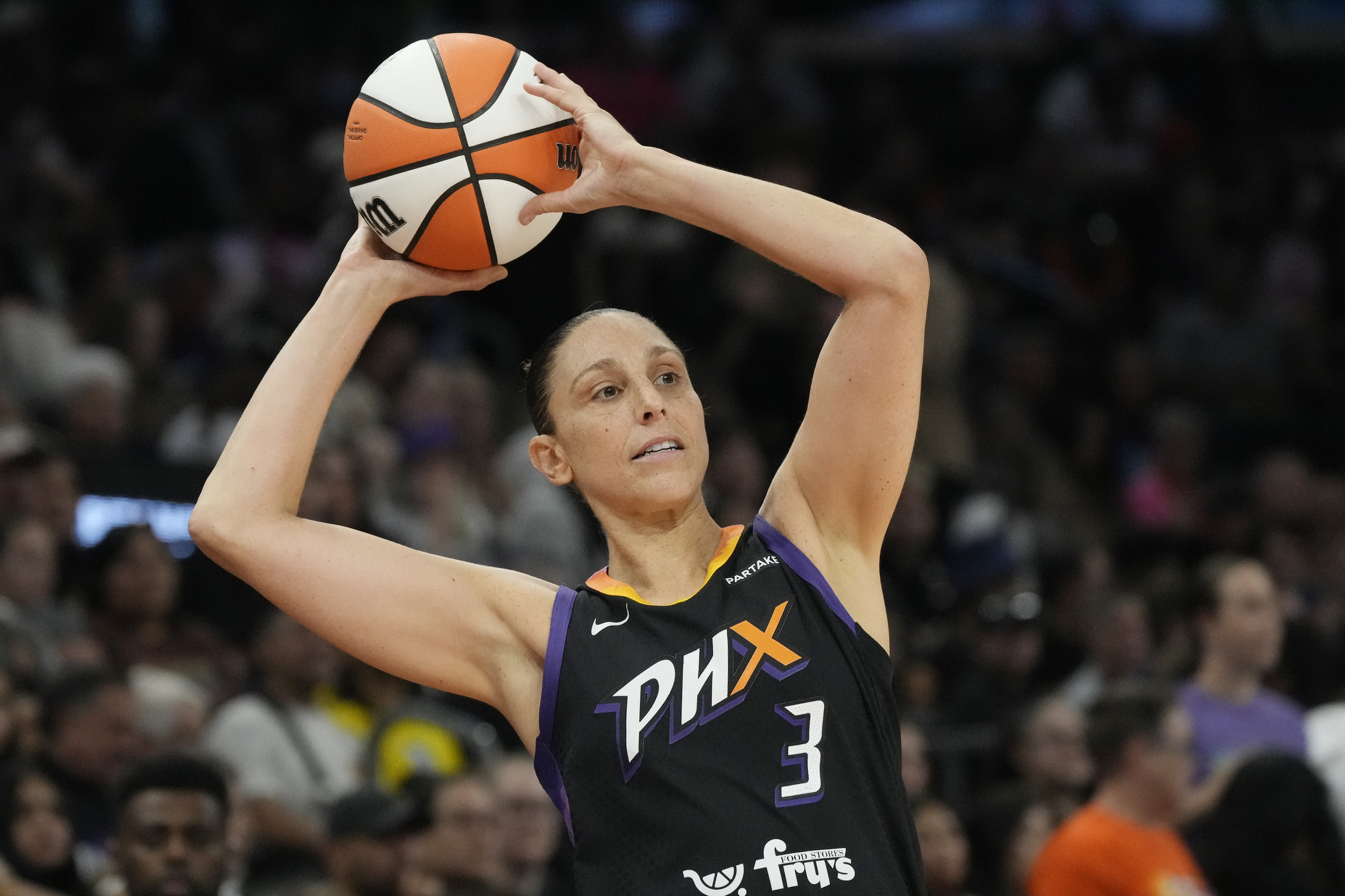 FILE - Phoenix Mercury guard Diana Taurasi looks to pass the ball against the Seattle Storm during the first half of a WNBA basketball game, Sept. 19, 2024, in Phoenix.