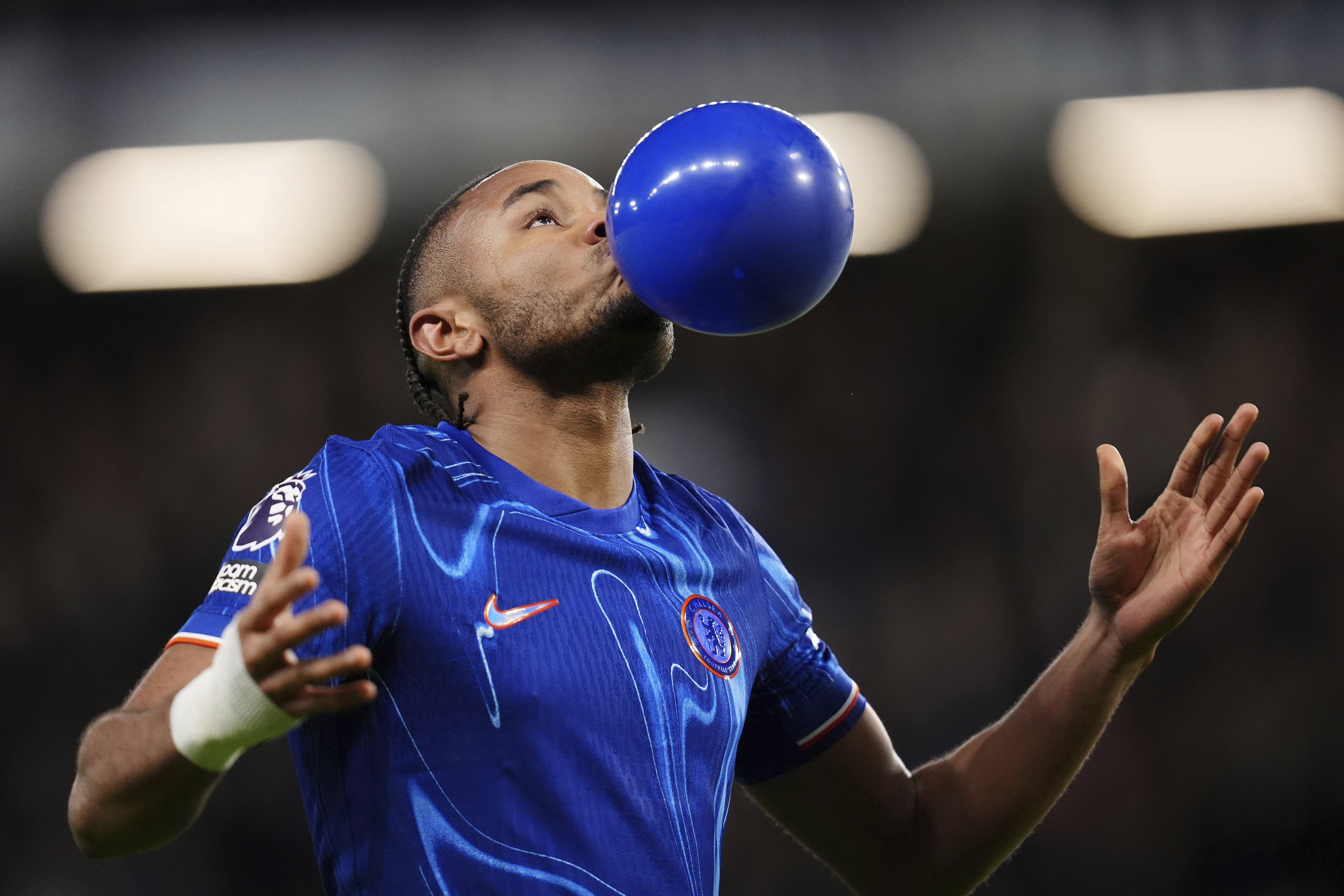 Chelsea's Christopher Nkunku celebrates scoring their side's first goal of the game during the English Premier League soccer match between Chelsea and Southampton at Stamford Bridge, London, Tuesday, Feb. 25, 2025.