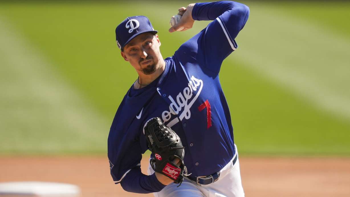 Los Angeles Dodgers starting pitcher Blake Snell throws during the first inning during a spring training baseball game against the Seattle Mariners, Tuesday, Feb. 25, 2025, in Phoenix.