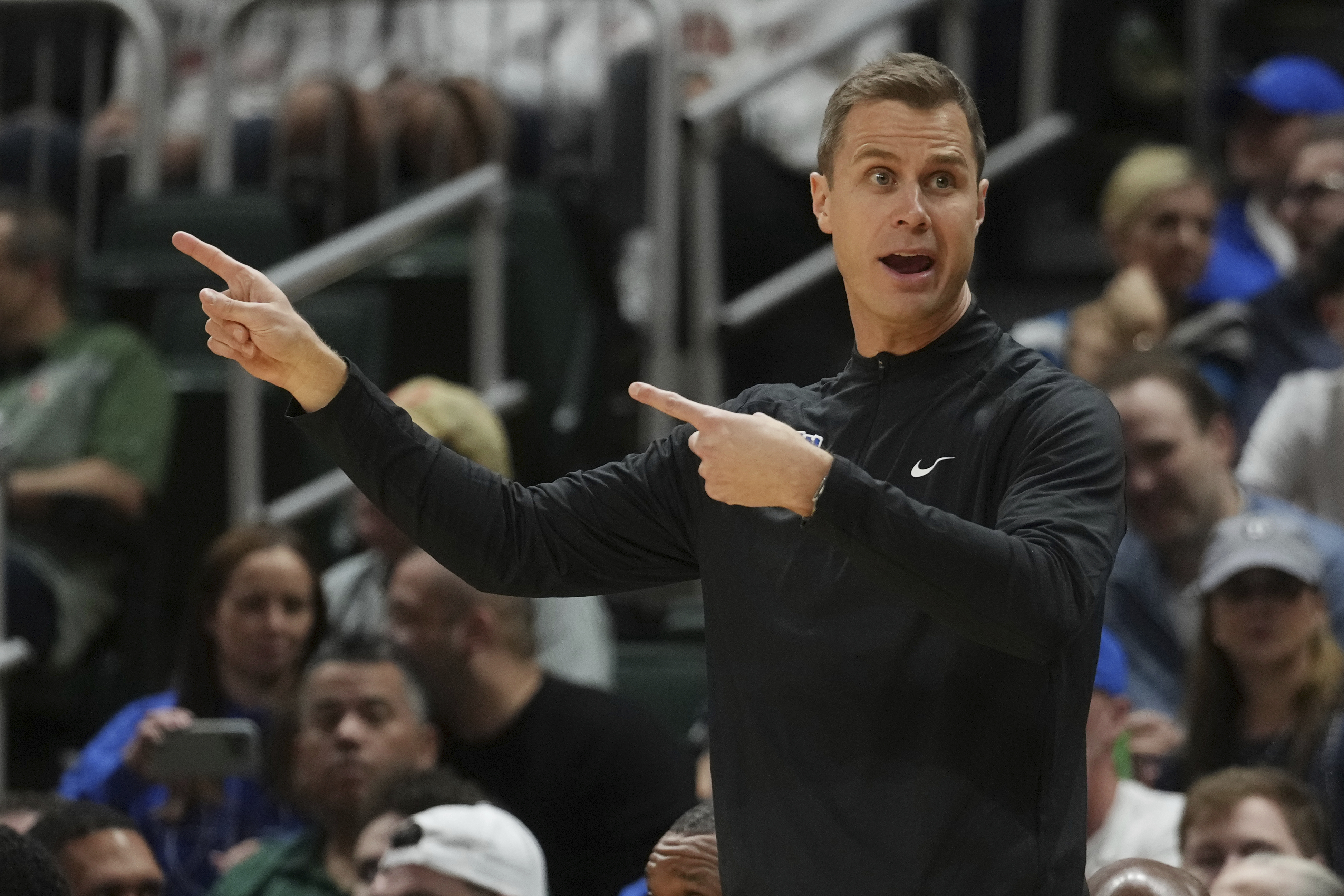Duke head coach Jon Scheyer gestures during the first half of an NCAA college basketball game against Miami , Tuesday, Feb. 25, 2025, in Coral Gables, Fla. 