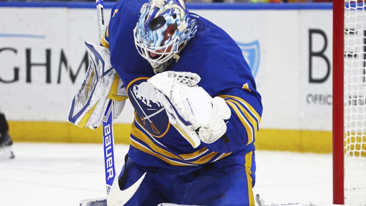 Buffalo Sabres goaltender Ukko-Pekka Luukkonen uses his mask to deflect the puck during the second period of an NHL hockey game against the Anaheim Ducks, Tuesday, Feb. 25, 2025, in Buffalo, N.Y.