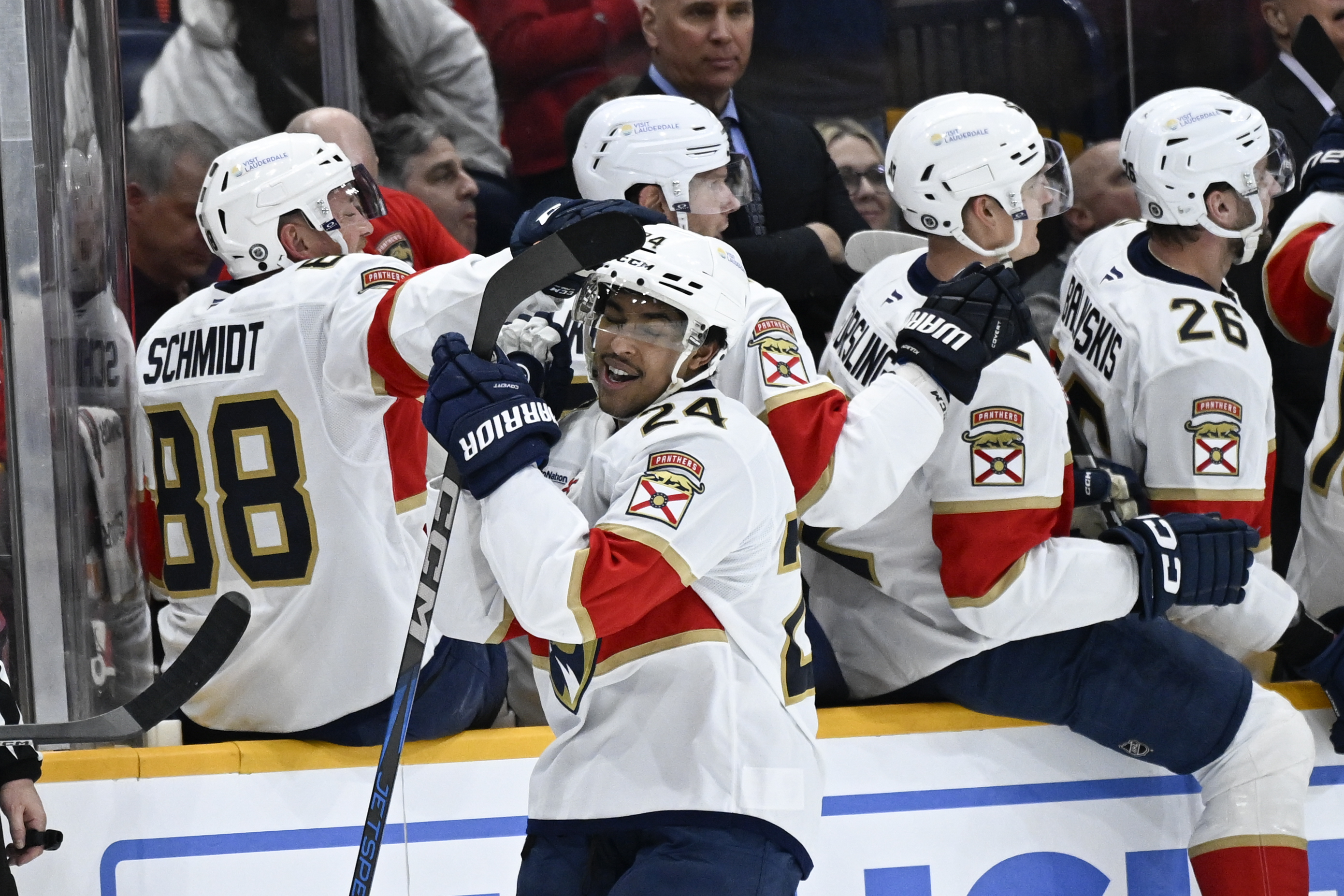 Florida Panthers right wing Justin Sourdif (24) is congratulated by defenseman Nate Schmidt (88) after scoring against the Nashville Predators during the second period of an NHL hockey game, Tuesday, Feb. 25, 2025, in Nashville, Tenn.