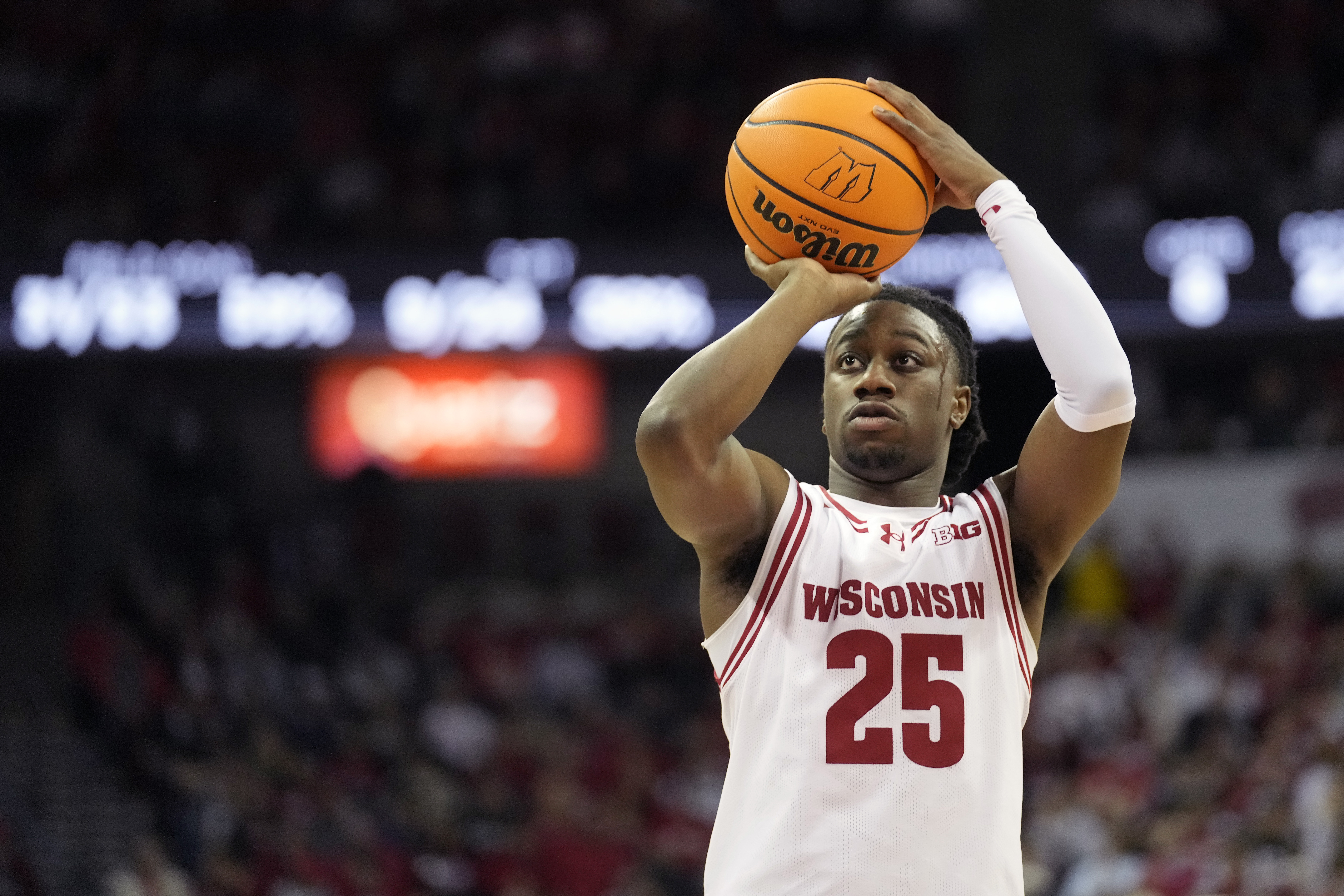 Wisconsin guard John Blackwell (25) scores a free throw during the second half of an NCAA college basketball game against Washington Tuesday, Feb. 25, 2025, in Madison, Wis. 