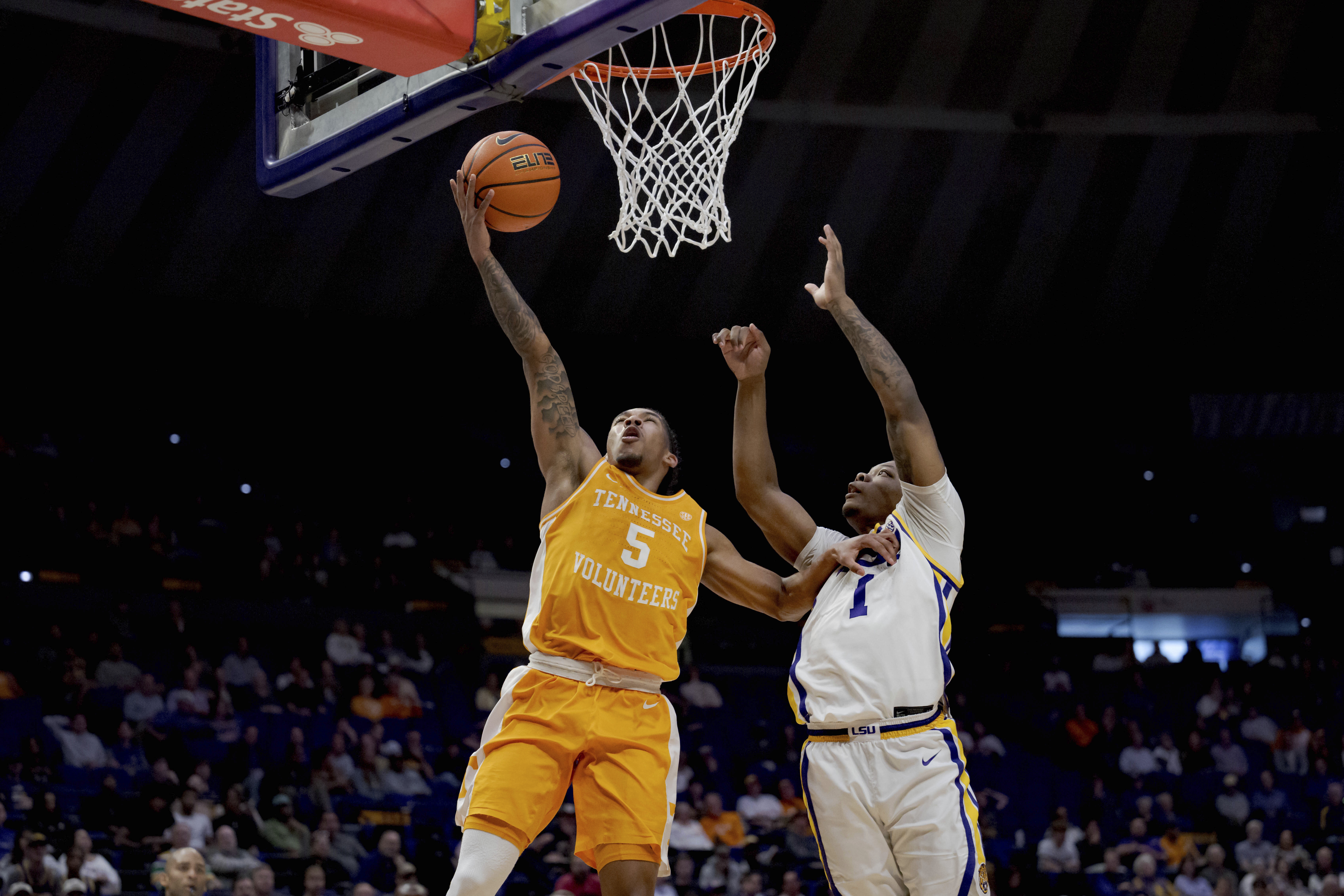 Tennessee guard Zakai Zeigler (5) shoots against LSU guard Jordan Sears (1) during the first half of an NCAA college basketball game in Baton Rouge, La., Tuesday, Feb. 25, 2025. 
