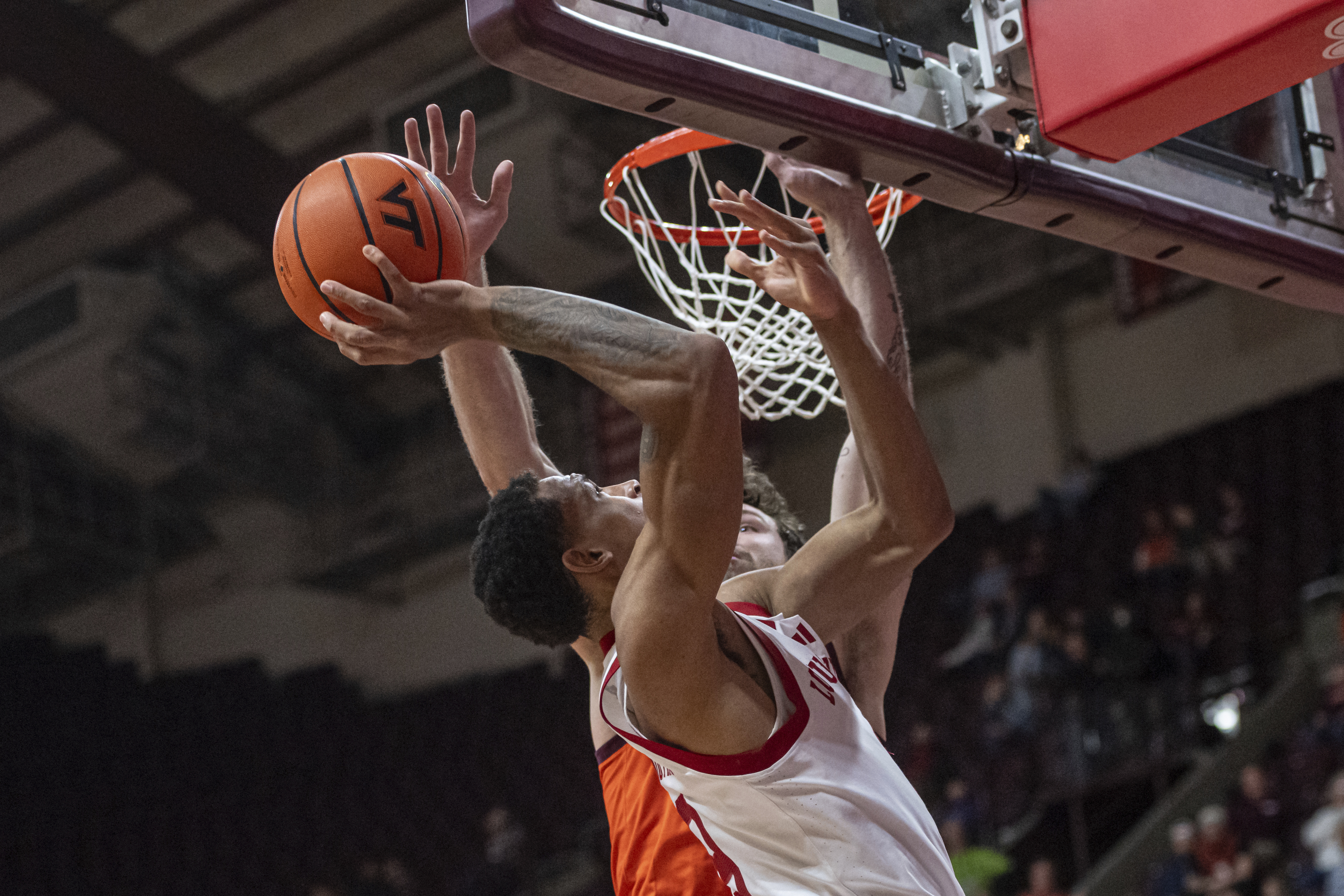 Virginia Tech's Ben Burnham (13) blocks Louisville's Khani Rooths (9) shot during the first half of an NCAA college basketball game, Tuesday, Feb. 25, 2025, in Blacksburg, Va. 