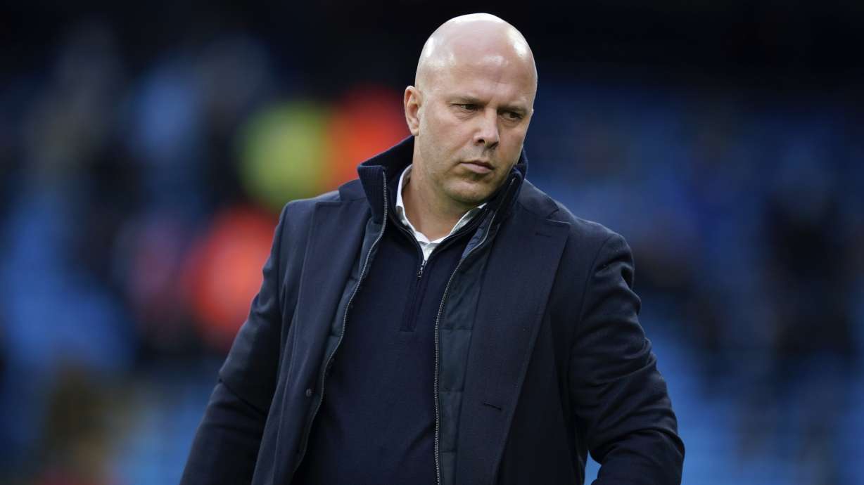 Liverpool's manager Arne Slot stands on the pitch prior to the English Premier League soccer match between Manchester City and Liverpool at Etihad stadium in Manchester, England, Sunday, Feb. 23, 2025.