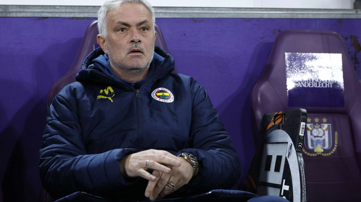 Fenerbahce's head coach Jose Mourinho, left, during the Europa League playoff second leg soccer match between Anderlecht and Fenerbahce at the RSC Anderlecht stadium in Brussels, Thursday, Feb. 20, 2025.