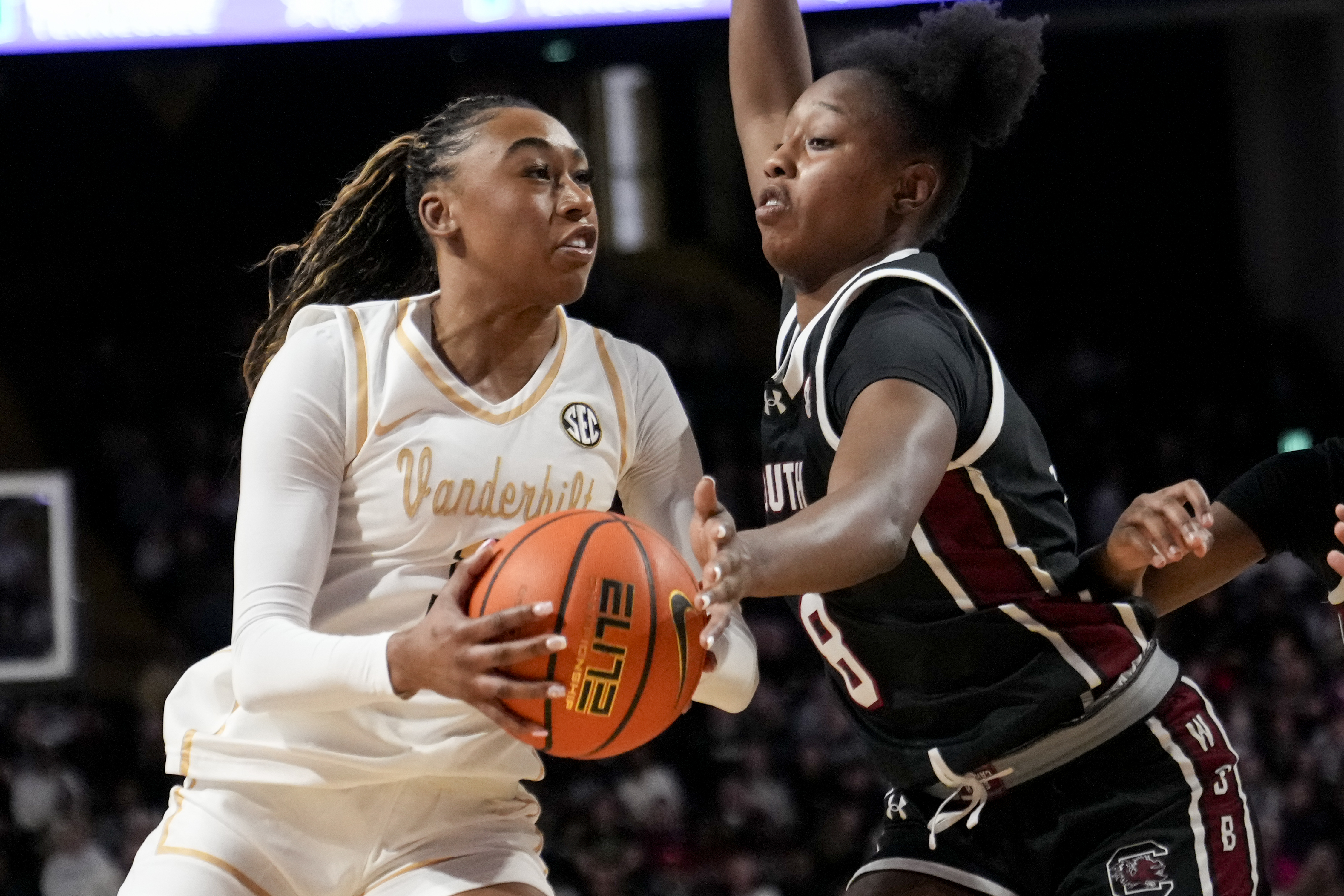 Vanderbilt guard Mikayla Blakes, left, goes to the basket past South Carolina forward Joyce Edwards (8) during the first half of an NCAA college basketball game Sunday, Feb. 23, 2025, in Nashville, Tenn. 