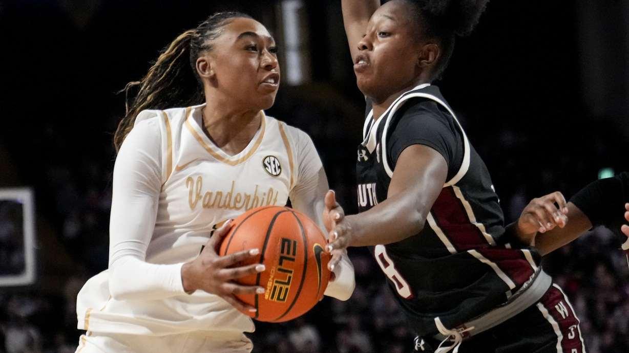 Vanderbilt guard Mikayla Blakes, left, goes to the basket past South Carolina forward Joyce Edwards (8) during the first half of an NCAA college basketball game Sunday, Feb. 23, 2025, in Nashville, Tenn.