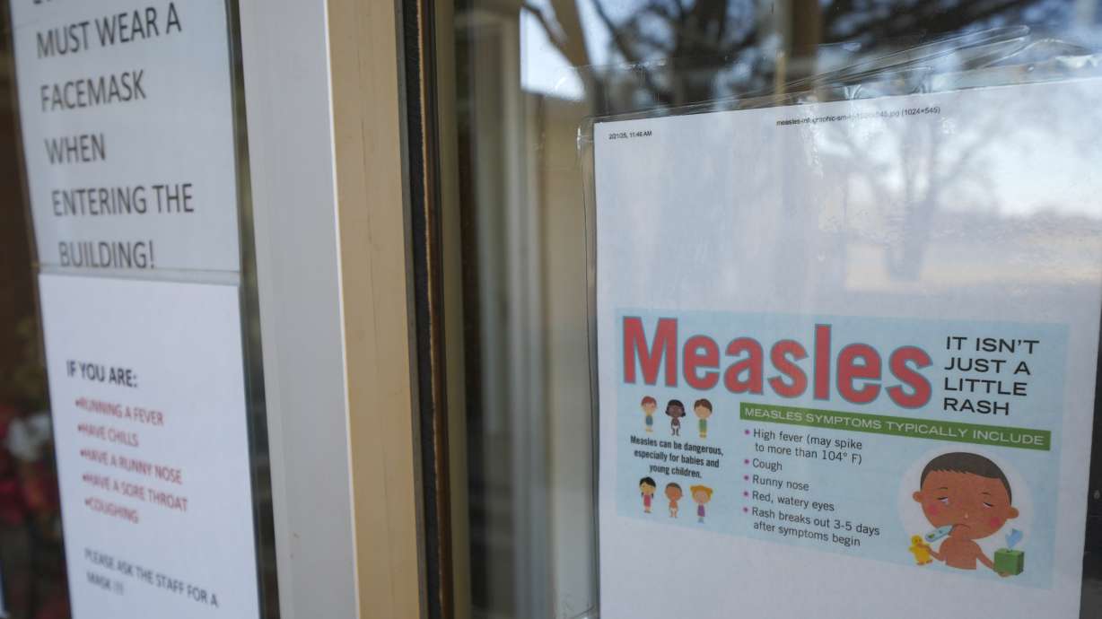 A sign is seen outside a clinic with the South Plains Public Health District Sunday in Brownfield, Texas. A child who was not vaccinated has died from measles in West Texas.