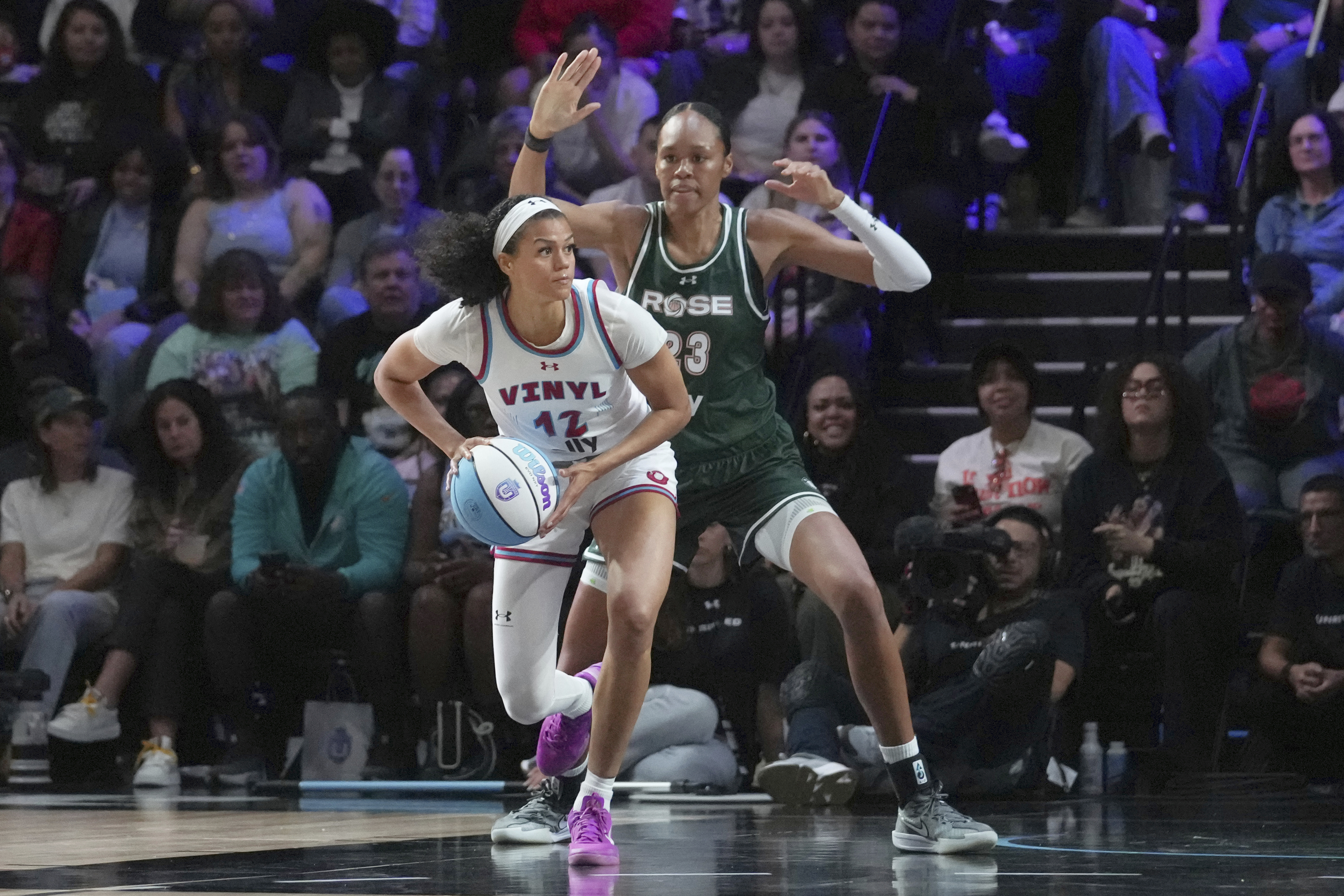 FILE - Vinyl's Rae Burrell (12) looks to pass the ball as Rose's Azura Stevens (23) defends during the Unrivaled 3 on 3 inaugural basketball game, Friday, Jan. 17, 2025, in Medley, Fla. 